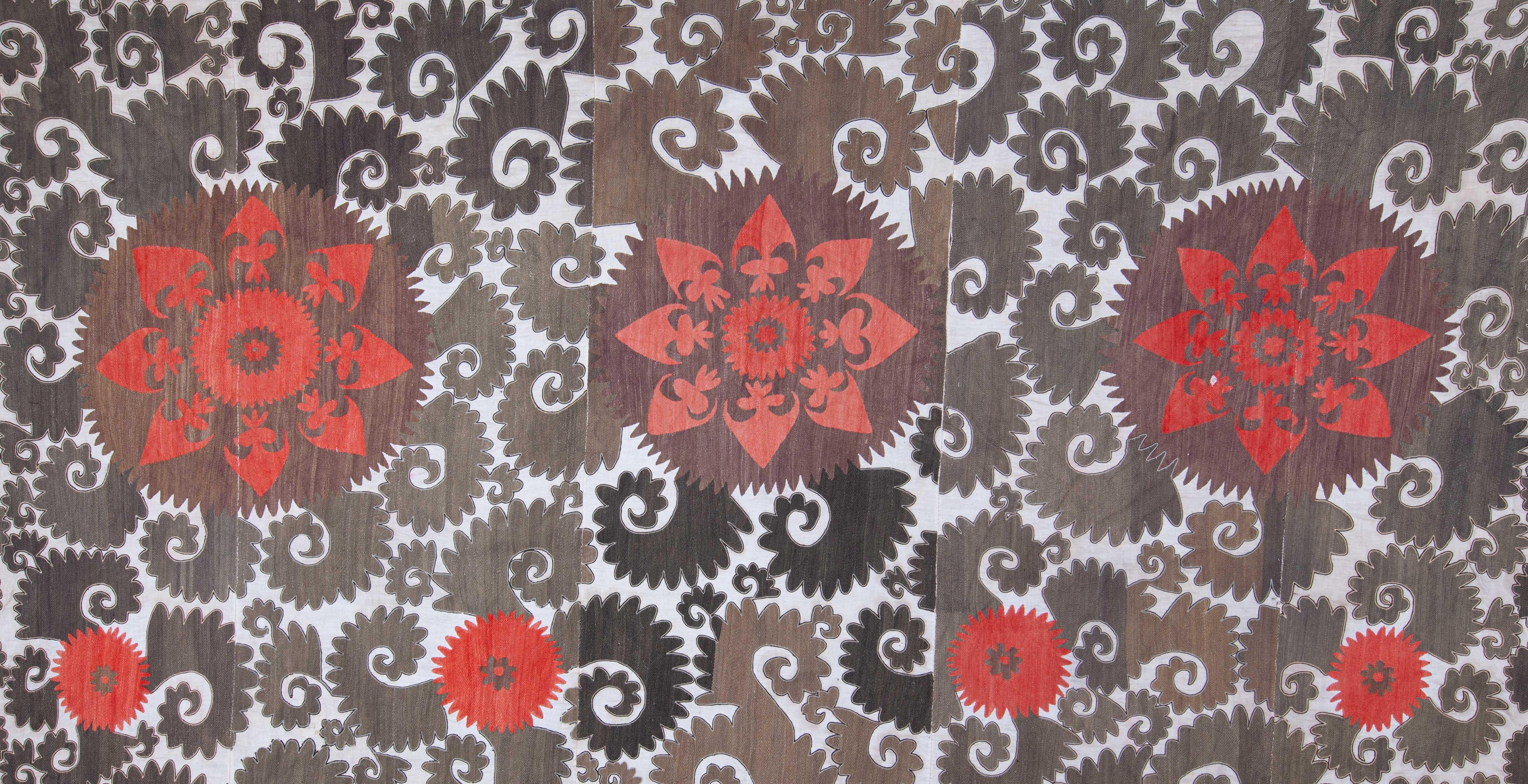 An unusually big Suzani embroidered in silk.