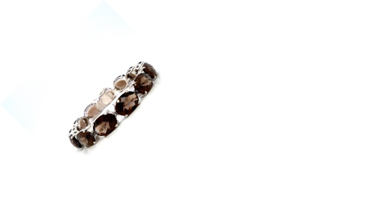 Beautifully handcrafted Handmade Smoky Topaz Tennis Bracelet, designed with love, including handpicked luxury gemstones for each designer piece. Grab the spotlight with this exquisitely crafted piece. Inlaid with natural topaz gemstones, this