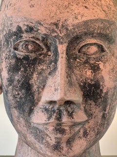 Giant terracotta head sculpture
