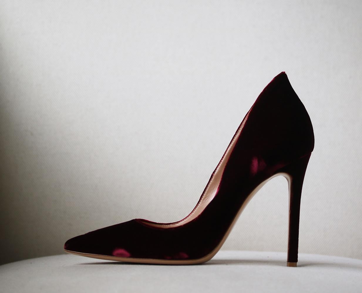 Italian label Gianvito Rossi is world-renowned for timelessly elegant designs. These pumps are an exquisite example, expertly crafted and hand-finished from plush velvet in a rich burgundy hue. The pin-thin heel and pointed silhouette have a