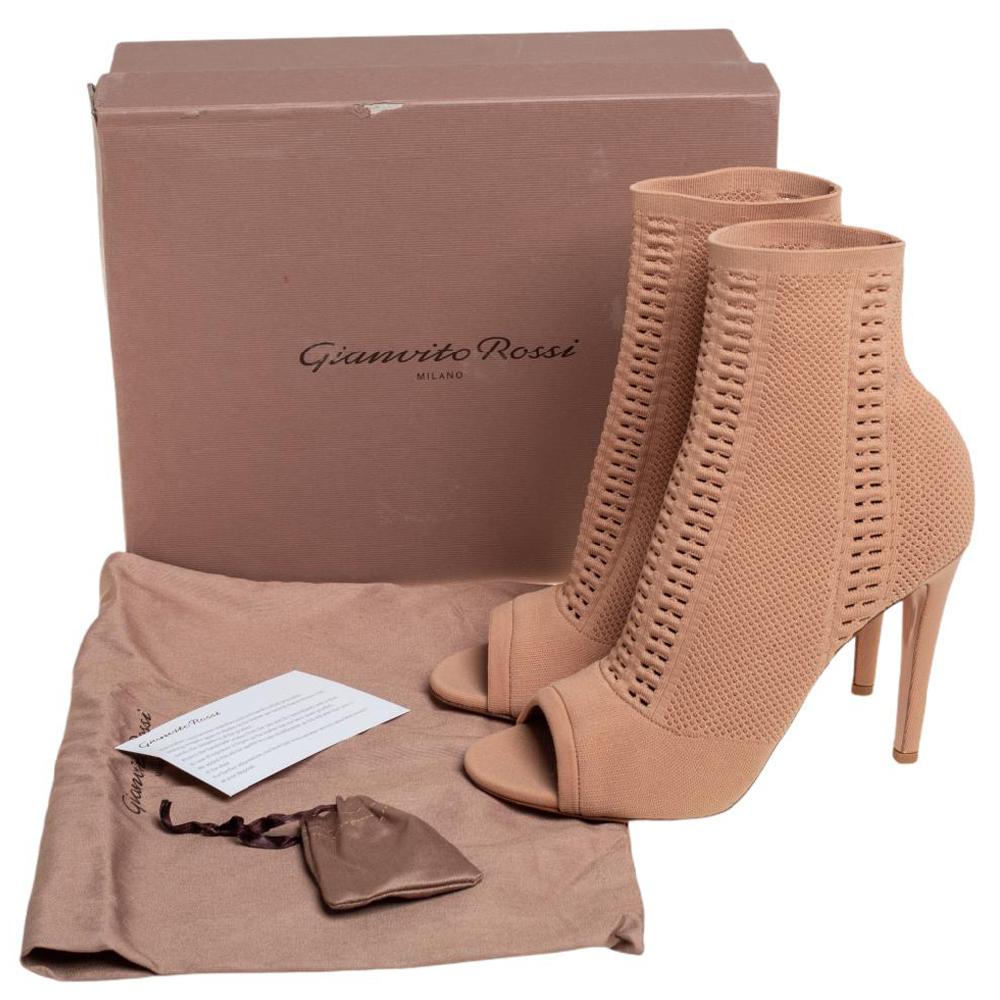 Add the Gianvito Rossi charm to your shoe collection with this pair of ankle boots. Crafted using knit fabric, the boots feature open toes and a comfortable, sock-like fit. They are lifted on 11.5 cm heels.

Includes: Original Dustbag, Original Box,