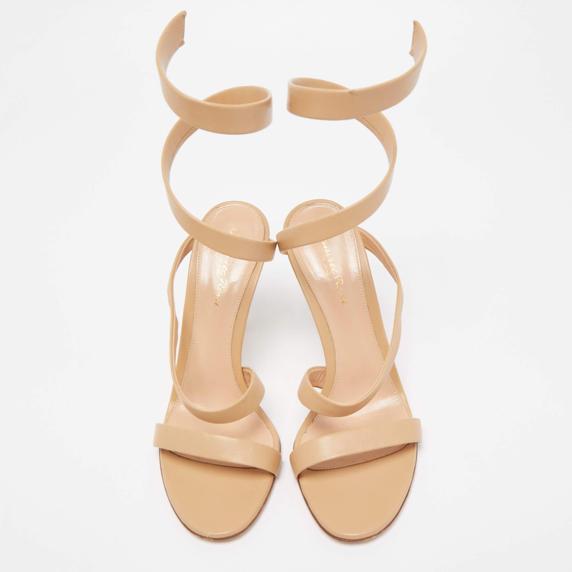 These sandals by Gianvito Rossi embody high-fashion from every angle. They are crafted from satin and are meant to be flaunted. The sandals feature single straps across the toes, wrap-around straps on the ankles, and 10cm heels.

