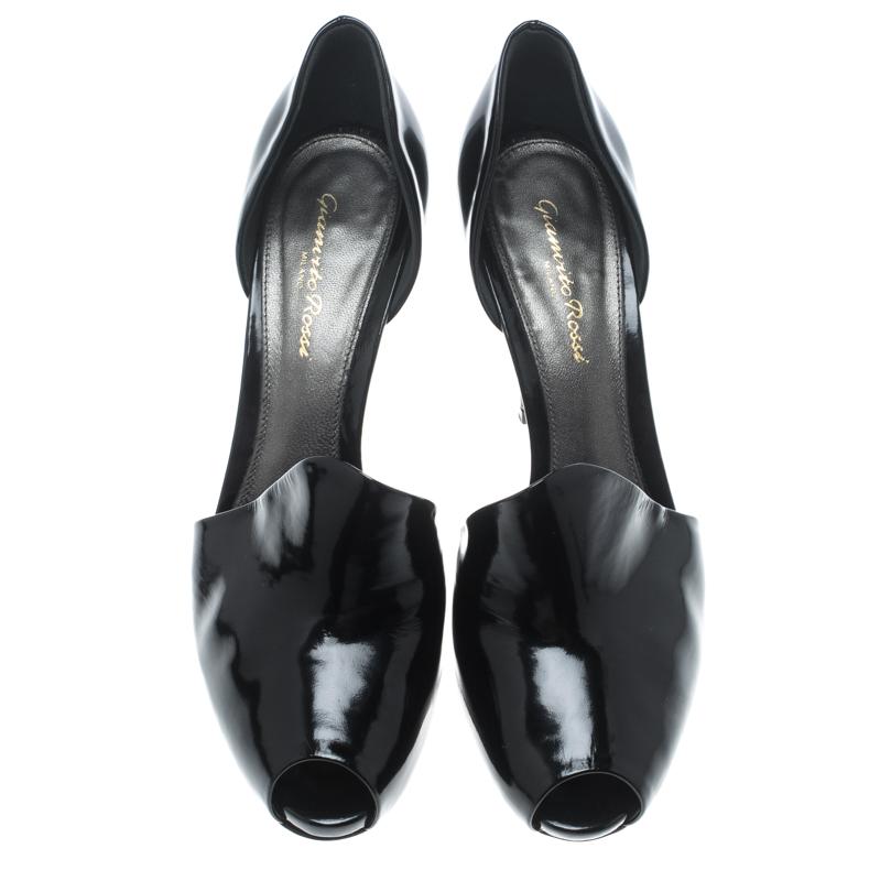 Chic, stylish and very modern, these pumps from Gianvito Rossi definitely need to be on your wishlist. These black beauties are crafted from patent leather and feature a sophisticated peep toe silhouette. They've been cut in a D'orsay style amd