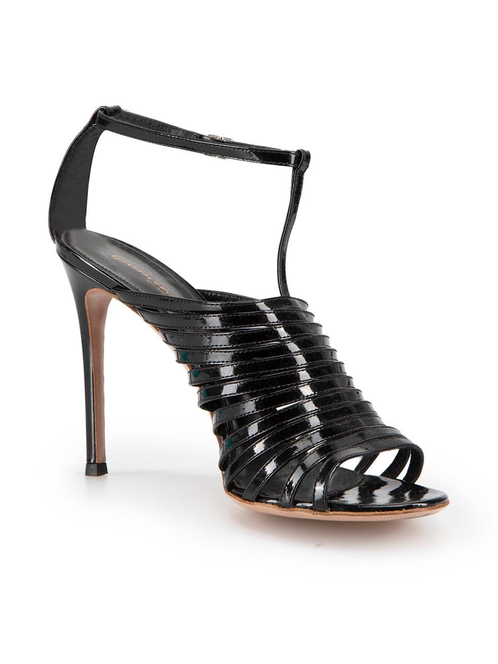 CONDITION is Very good. Minimal wear to sandals is evident. Minimal wear to uppers however mild abrasion to soles seen on this used Gianvito Rossi designer resale item.
  
Details
Black
Patent leather
Heeled sandals
High heel
Strappy
Open