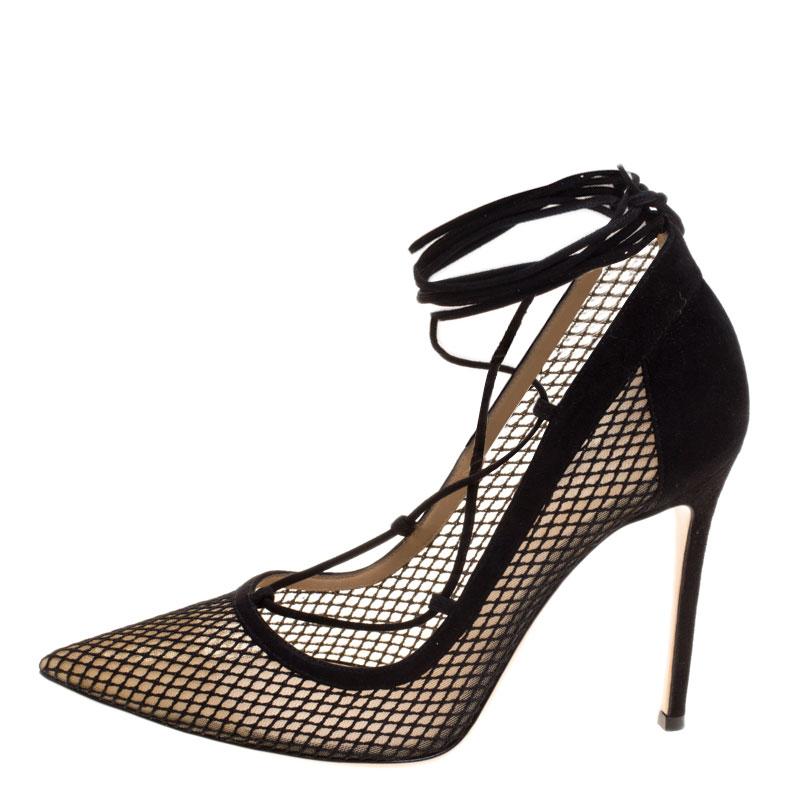 A perfect pair of shoes for the modern and young woman, these Gianvito Rossi pointed-toe pumps are stylish and unique for those evening parties and glam events. Constructed in black suede and mesh body, these shoes are further accented with a