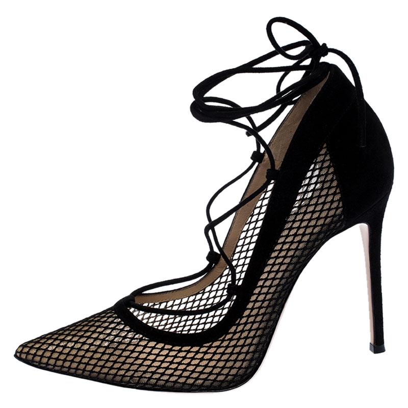 A perfect pair of shoe for the modern woman, these Gianvito Rossi pointed-toe pumps are stylish and unique for those evening parties and glam events. Constructed in black suede and mesh, these shoes are further accented with lace-ups that wrap