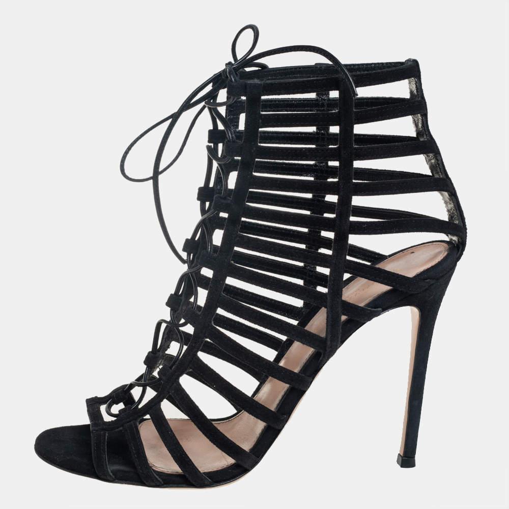 In a glorious design of black hue comes these sandals from Gianvito Rossi for you to waltz in glamour. The sandals feature a strappy caged design with laces, open toes, and are balanced on 11 cm heels to give you the right lift of poise.

