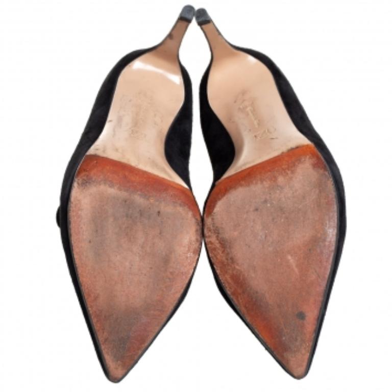 These fabulous boots from Gianvito Rossi are chic and worth admiring! They have been crafted from black suede and styled with pointed toes and slits on the counters. They come equipped with comfortable leather-lined insoles and stand tall on 9 cm