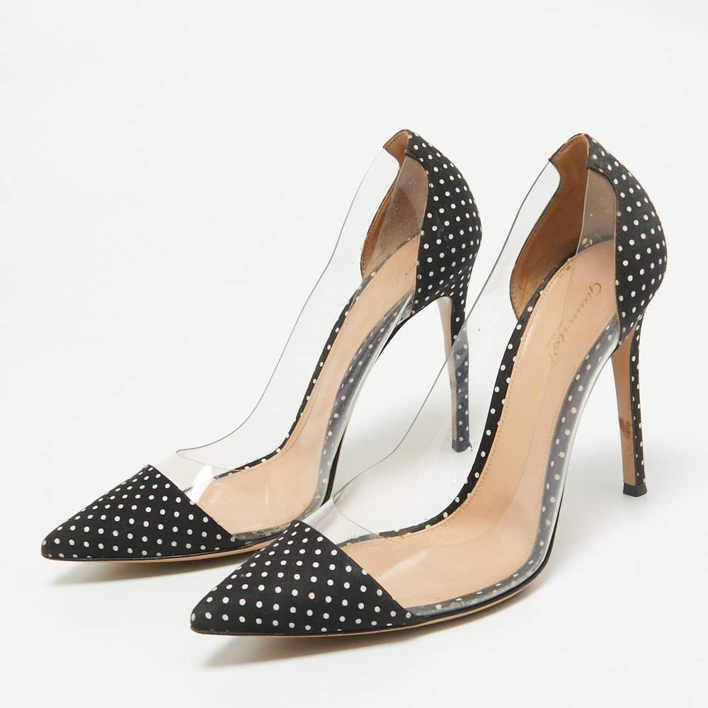 The white and black shade of this pair of Gianvito Rossi pumps makes it pleasing and desirable. Created from PVC and fabric these shoes are designed with precision and flaunt pointed toes The 12cm heels of this pair will offer you chic and bold