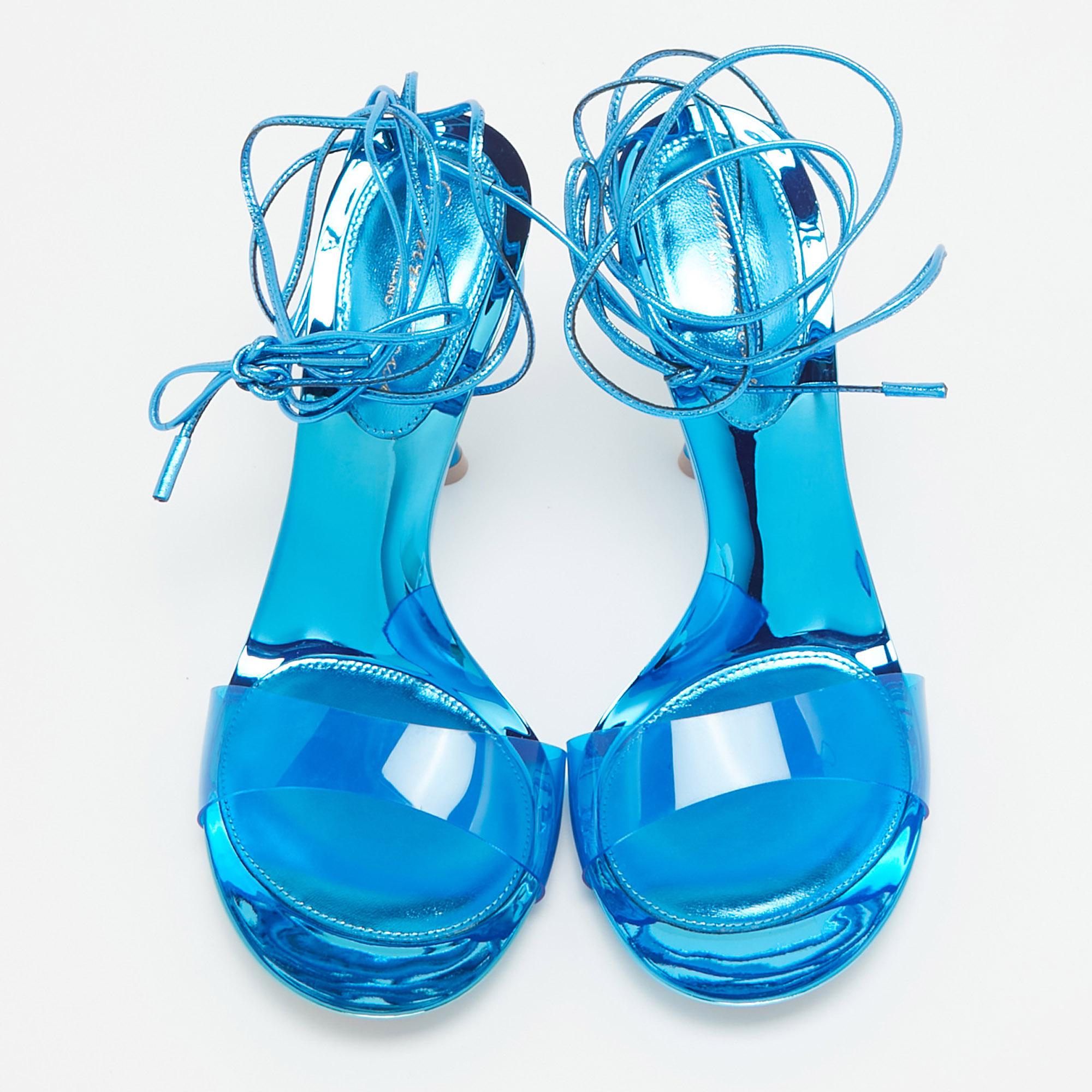 Indulge in luxury with Gianvito Rossi's Spice ankle tie Sandals. Crafted with meticulous attention to detail, these sandals boast a captivating blend of blue PVC and supple leather, culminating in a sophisticated ankle tie design that exudes
