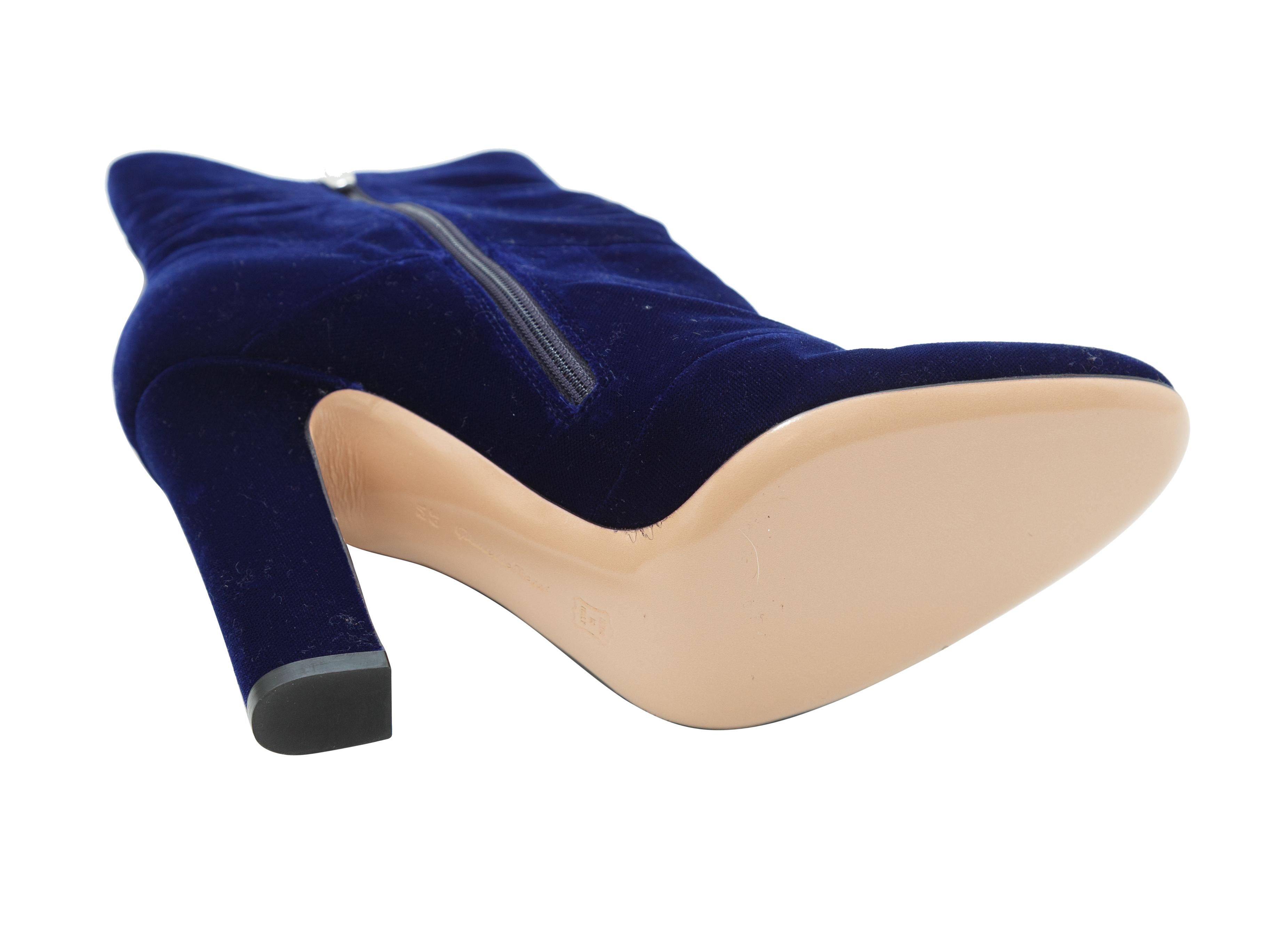 Product details:  Blue velvet ankle boots by Gianvito Rossi.  Inner zip closure.  Round toe.  Silvertone hardware.  4.25