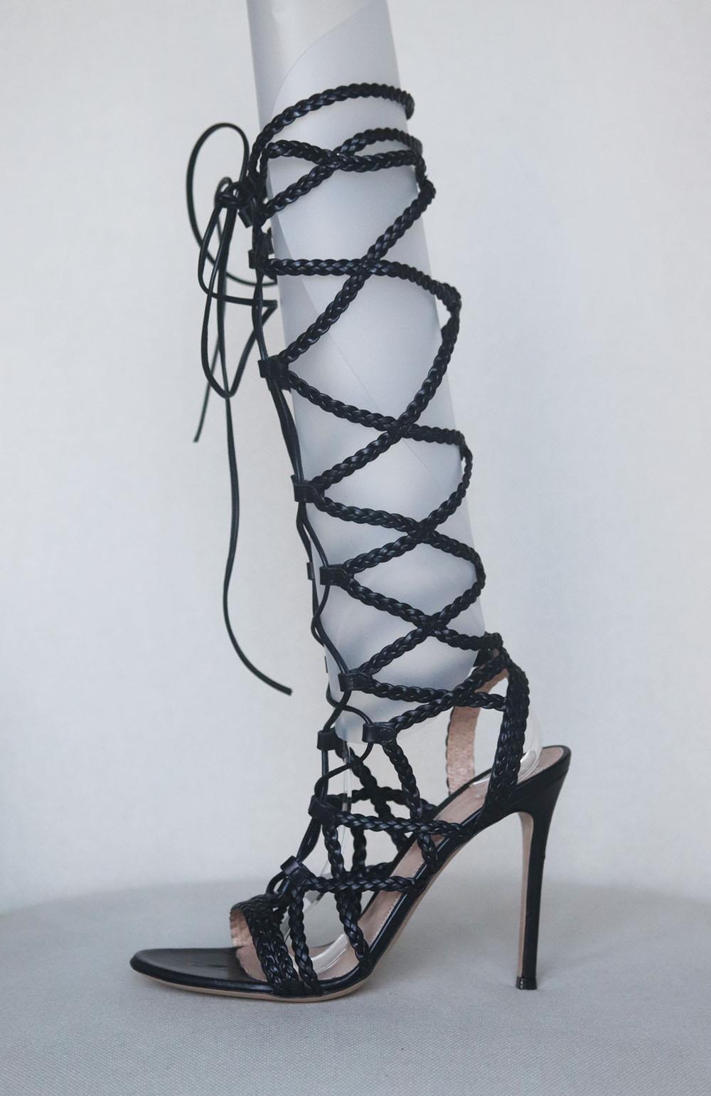 Gianvito Rossi's gladiator-inspired sandals are a key style to own this season, this knee-high pair is crafted from supple leather and has thin braided straps that lace-up along the front, allowing you to customize the fit. Heel measures