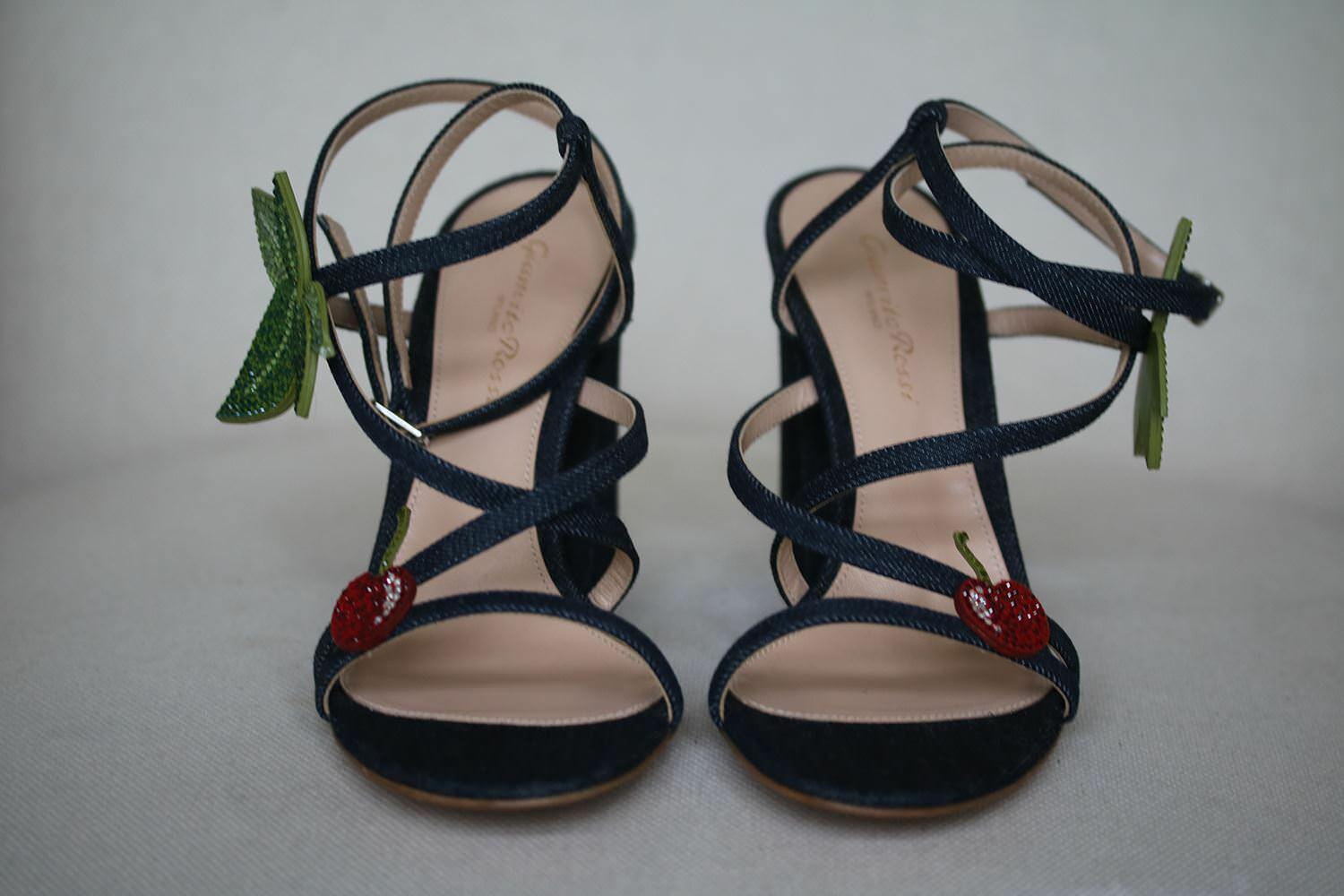 Blue denim sandal covered block heel featuring a crystal cherry applique from Gianvito Rossi. Item fits true to size. 100% Cotton. Colour: blue. Heel measurea approx. 3.9 inches. Does not come with a box. 

Size: EU 37.5 (UK 4.5, US 7.5)

Condition: