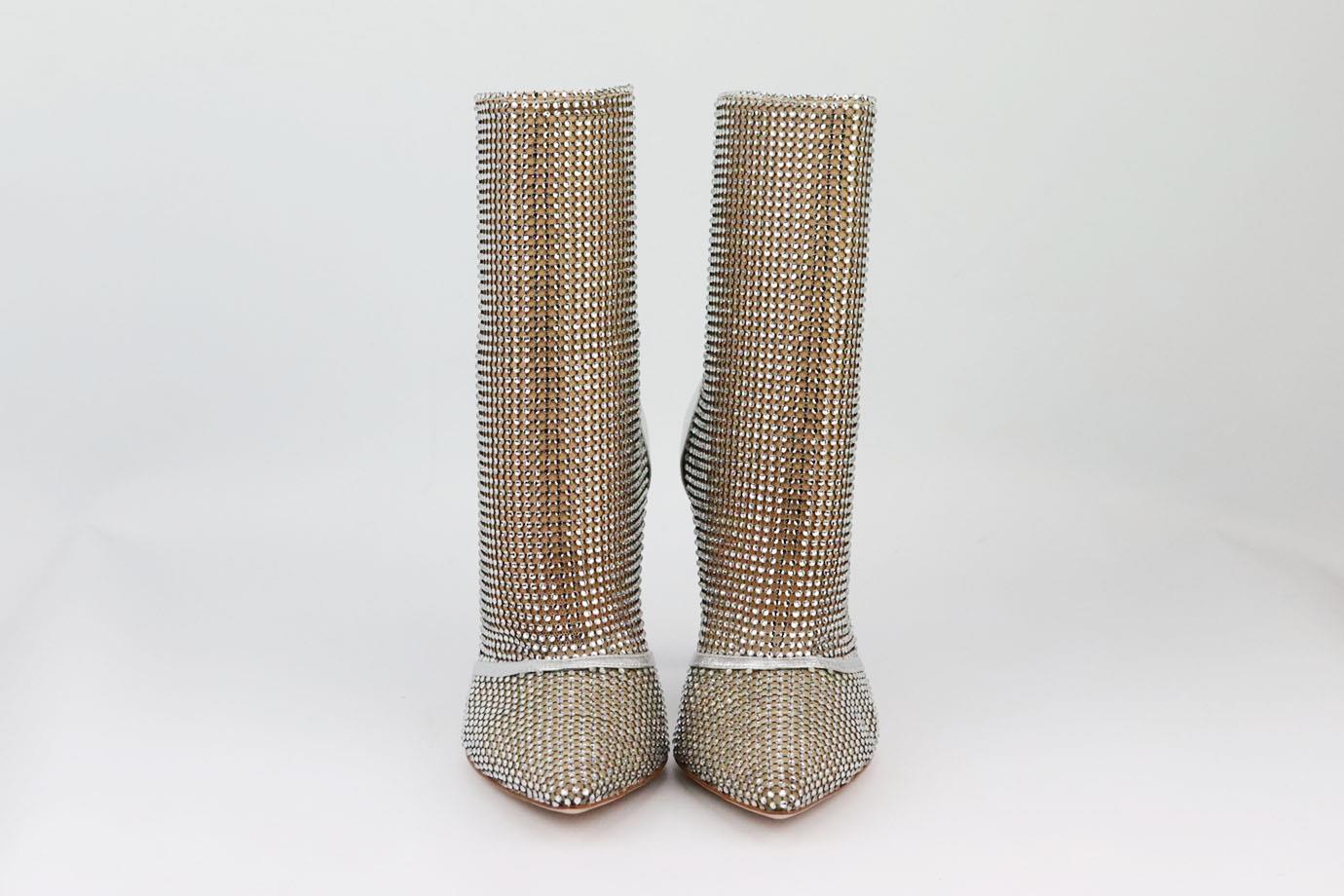 These crystal-embellished ankle boots by Gianvito Rossi are made in a sleek point-toe silhouette, they're soaked in tiny crystals and accented by silver leather, they sparkle at every angle, so you'll look especially glamorous under flashing lights.