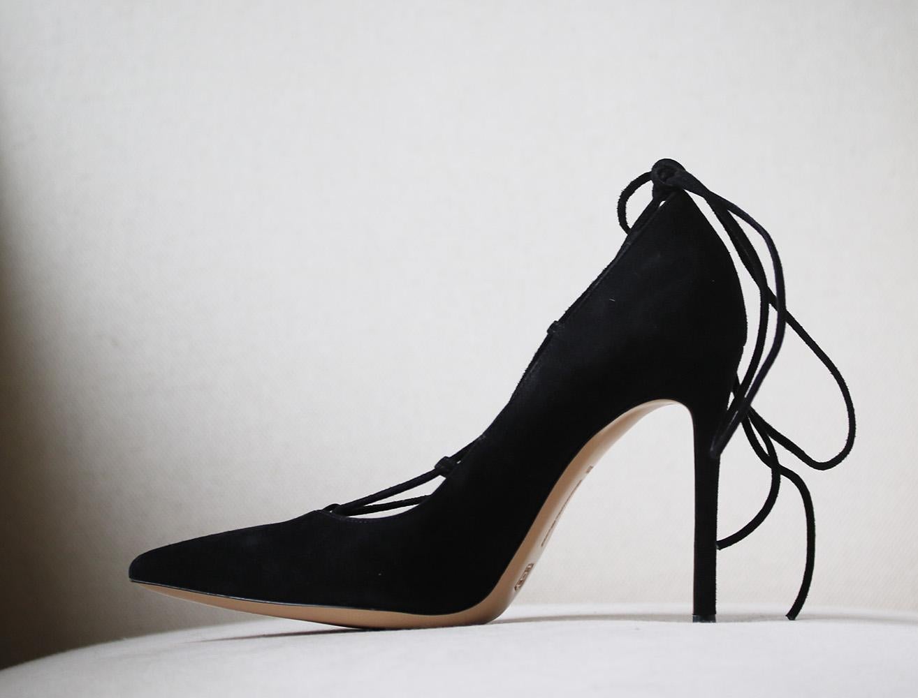 The epitome of modern elegance, these Femì pumps from Gianvito Rossi provide a stylish finishing touch to both day and evening attire. Accented with a pointed toe, lace-up front and stiletto heel, this expertly crafted black suede pair is as