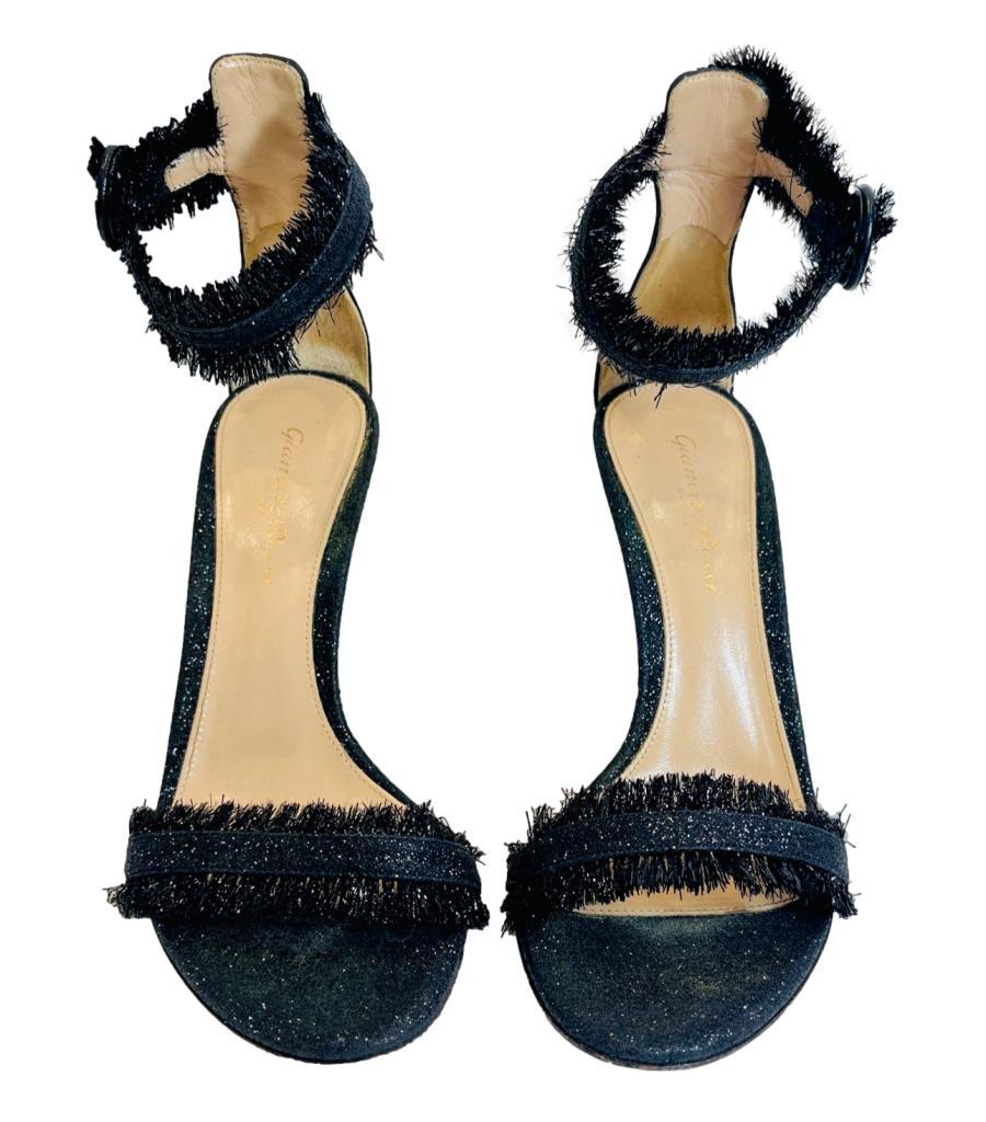 Gianvito Rossi Frayed Detail Suede Sandals
Black 'Lola' sandals designed with frayed sparkling straps to the vamp and ankle.
Featuring round open toe and 10cm stiletto heel.
Size – 37
Condition – Very Good (Small signs of wear)
Composition –