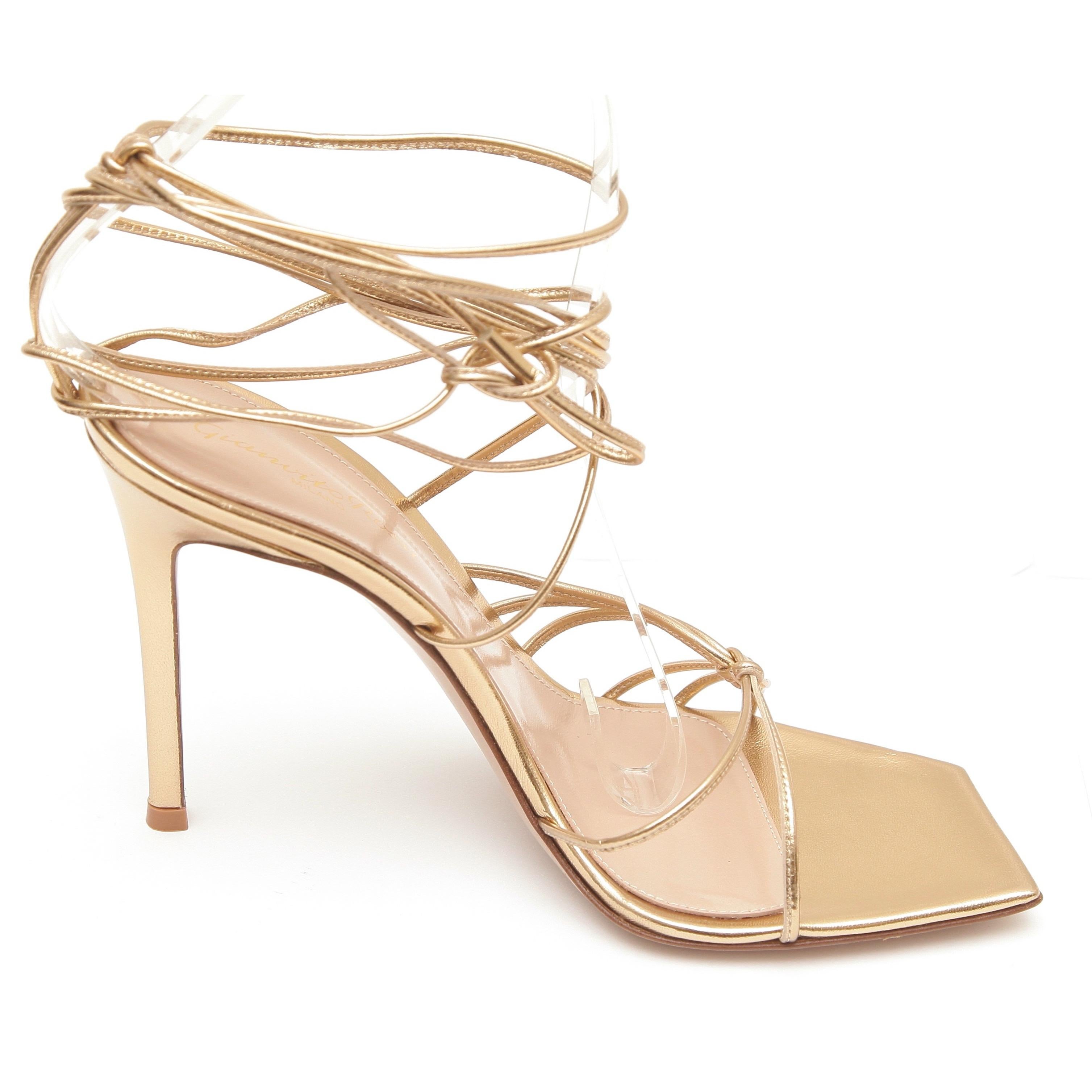 GUARANTEED AUTHENTIC GIANVITO ROSSI SYLVIE METALLIC ANKLE TIE SANDALS


Details:
- Metallic gold leather upper.
- Caged thin straps over vamp.
- Crisscross ankle tie closure.
- Leather insole and sole.
- Comes with box and dust bag.

Size: