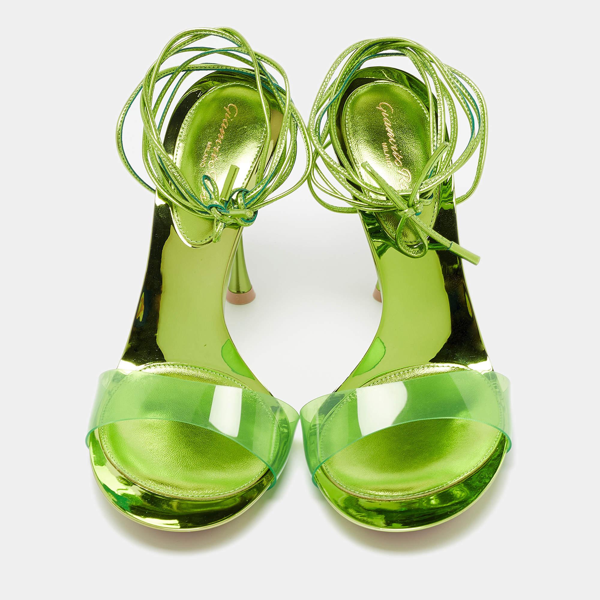 Crafted by Gianvito Rossi, these exquisite sandals seamlessly blend PVC with supple leather, creating an alluring contrast. The delicate ankle ties add a touch of femininity, while the sleek design exudes modernity. Perfect for showcasing a