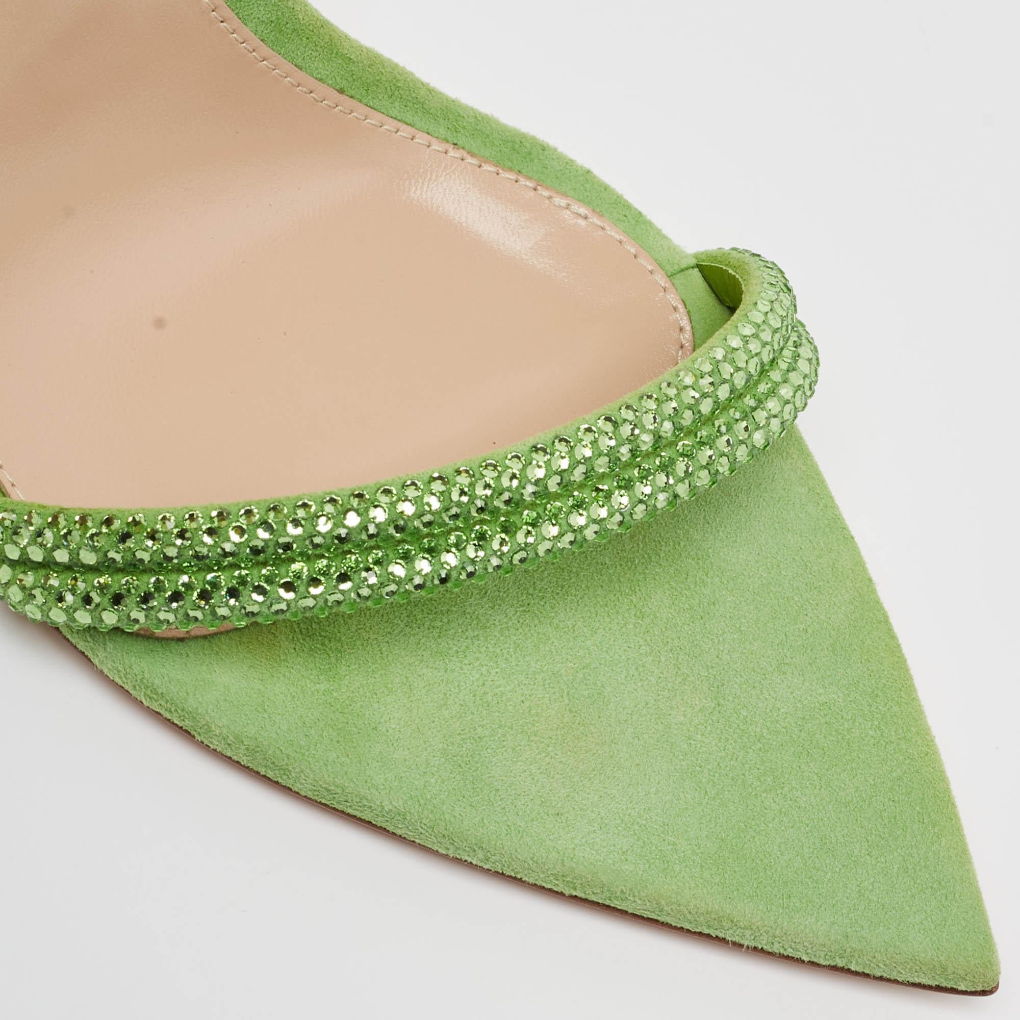 In classy green suede, the Gianvito Rossi Montecarlo sandals exude confident charm. Delicate straps gracefully embrace the foot, while a sturdy heel provides stability and style. With impeccable craftsmanship and timeless design, these sandals