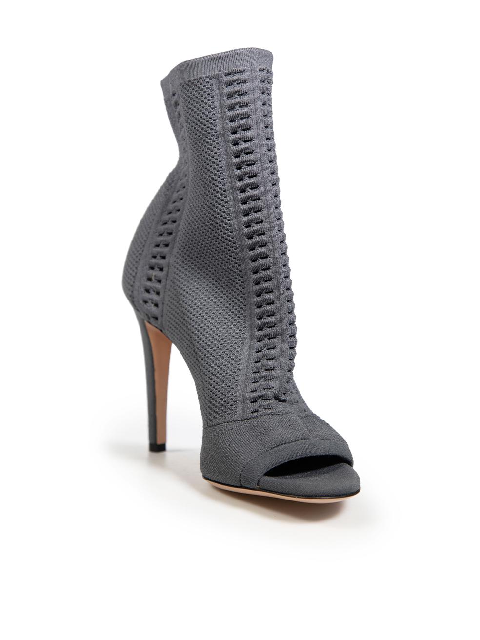CONDITION is Never worn. No visible wear to the boots is evident, however, due to poor manufacturing there is glue residue between the heel and the main body of the shoe on this on this new Gianvito Rossi designer resale item.
 
 Details
 Grey
