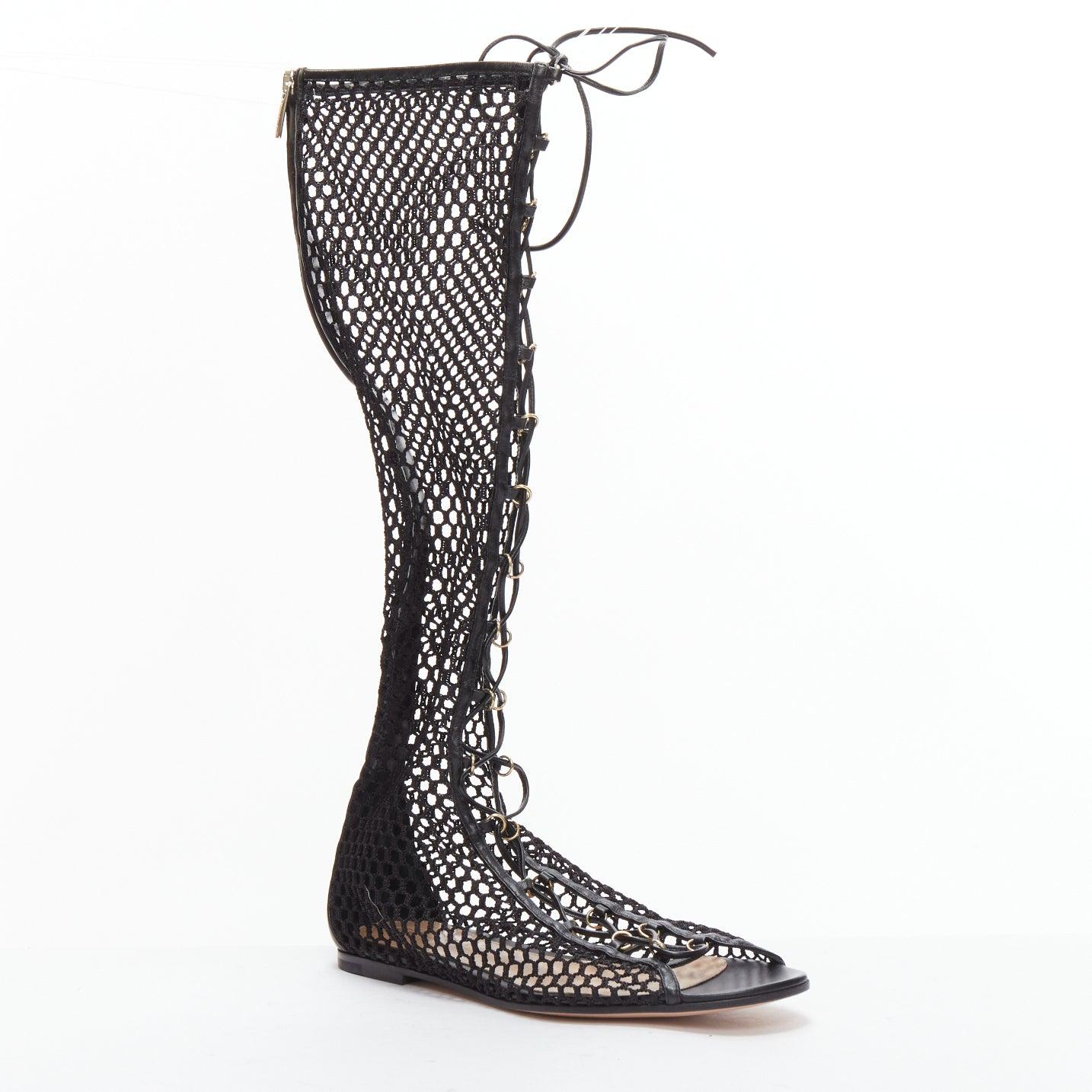 GIANVITO ROSSI Helena black crochet mesh gold rings lace up sandals EU38
Reference: BSHW/A00169
Brand: Gianvito Rossi
Model: Helena
Material: Leather, Mesh
Color: Black, Gold
Pattern: Solid
Closure: Zip
Lining: Nude Leather
Extra Details: Gianvito