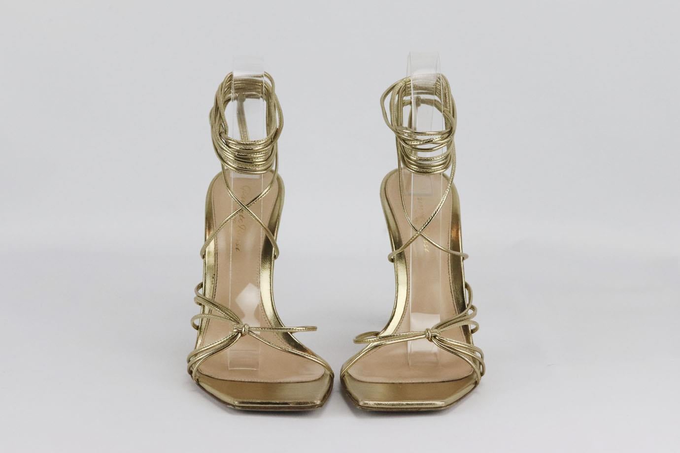 Gianvito Rossi lace up leather sandals. Gold. Lace up fastening at side. Comes with dustbag. Size: EU 39.5 (UK 6.5, US 9.5). Insole: 9.5 in. Heel: 3.5 in Very good condition - Some wear to soles. Light wear to upper material; see pictures.
