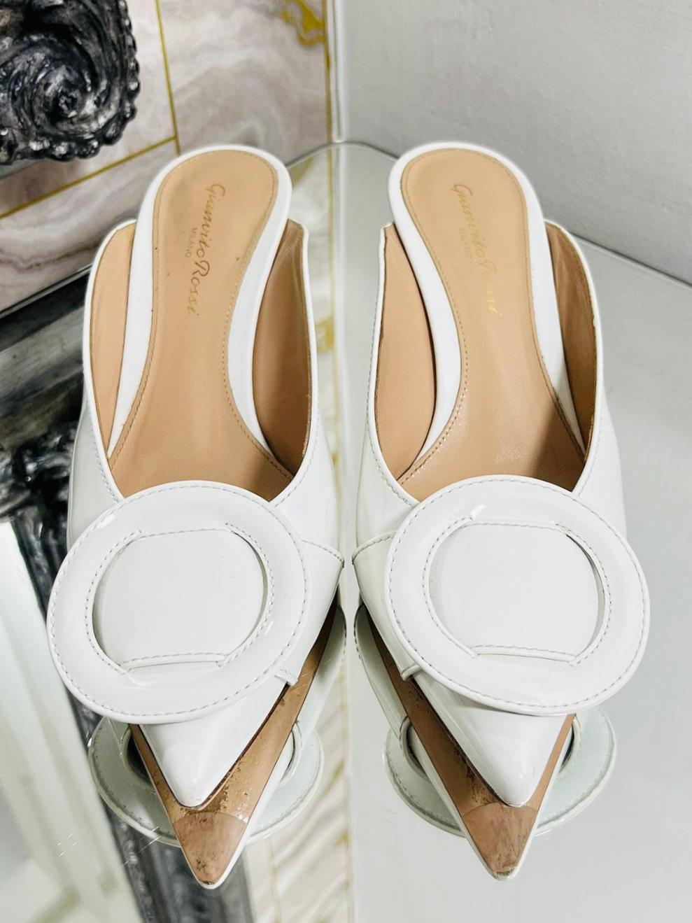 Gianvito Rossi Leather Round Buckle Mules

White kitten heels with round buckle feature to fronts.

Size - 35.5

Condition - Good (Some marks to leather and heel)

Composition - Leather

Comes With - Box