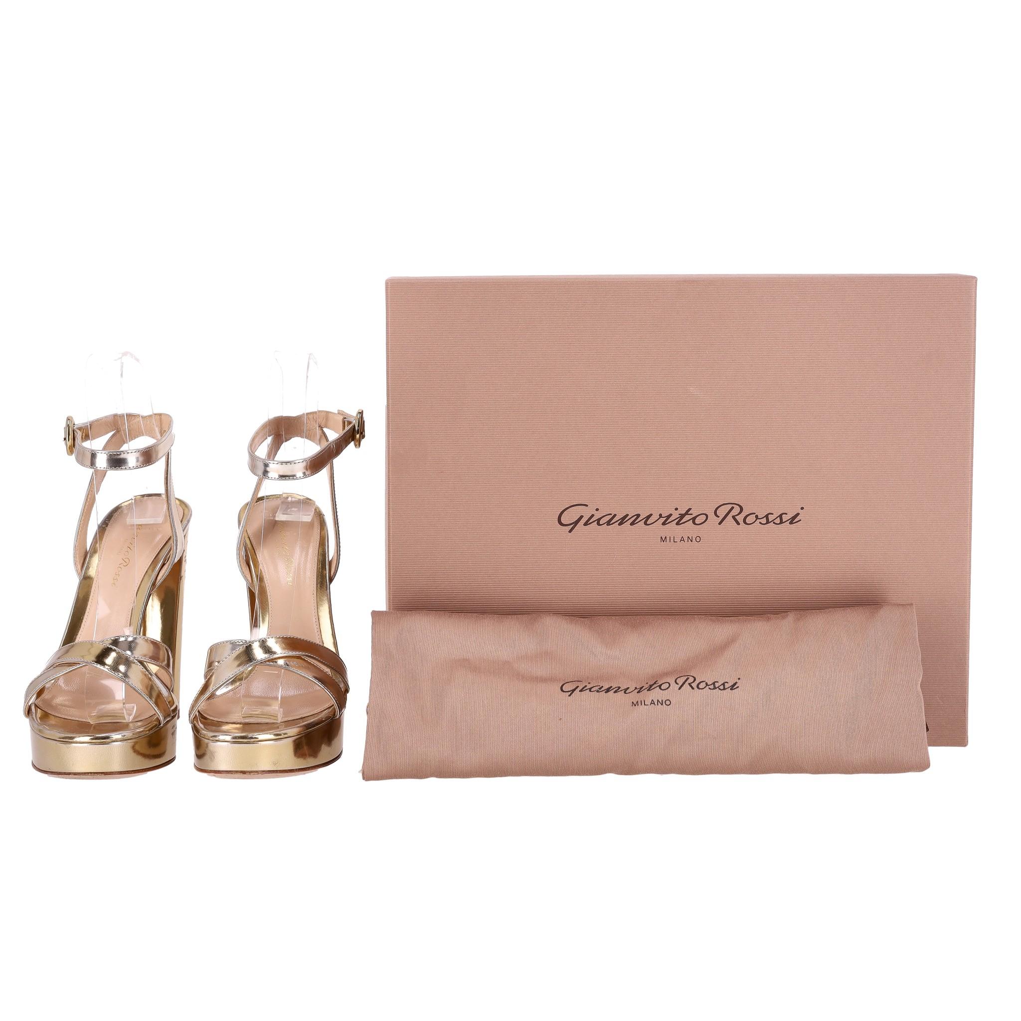 Gianvito Rossi Metalic Patent Leather Platform Sandals

Metallic gold 'Poppy' platform sandals crafted in Italy with a buckled ankle strap and crossover front.

Featuring a high block heel and leather insoles.

Rrp Approx. £700

Size – 36

Condition