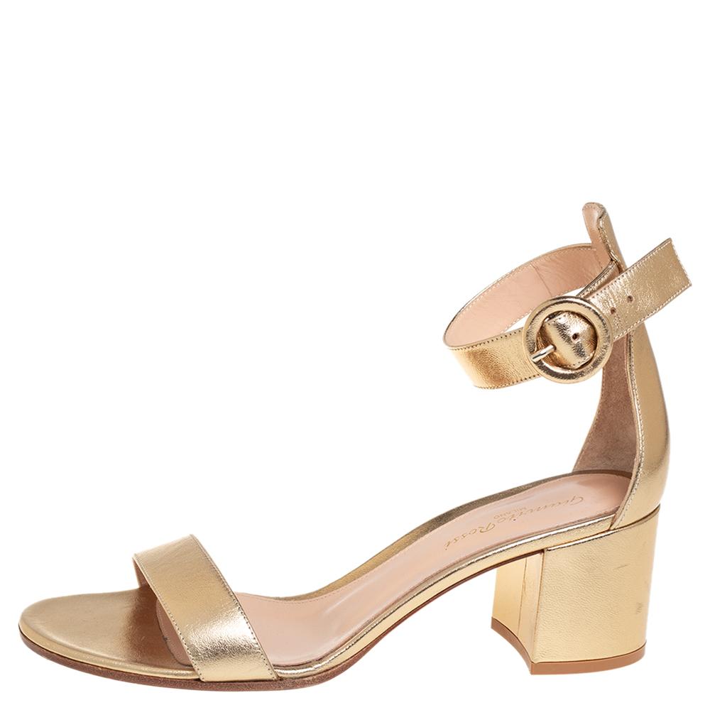 Gianvito Rossi's Portofino sandals have been crafted in Italy from metallic gold leather. This versatile pair has dual slim straps that elegantly frame your ankle and toes and a chic round buckle. Wear it with dresses, pantsuits, or denim pants!

