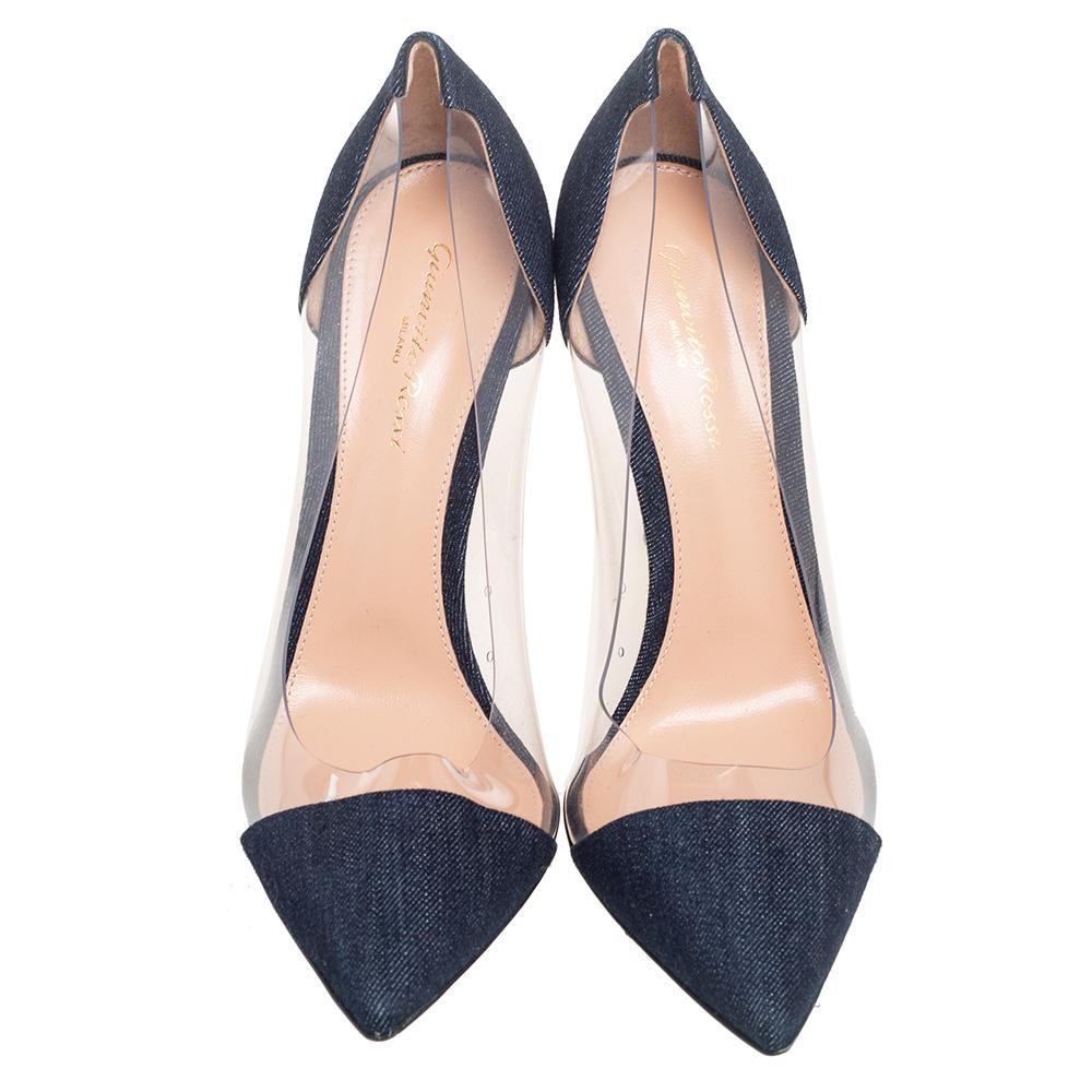 The Plexi pump is one of Gianvito Rossi's most iconic designs. The shoe is a pointed toe pump made from PVC and other durable materials in grand shades. This elegant pair is made from navy blue denim as well as clear PVC and lifted by slim