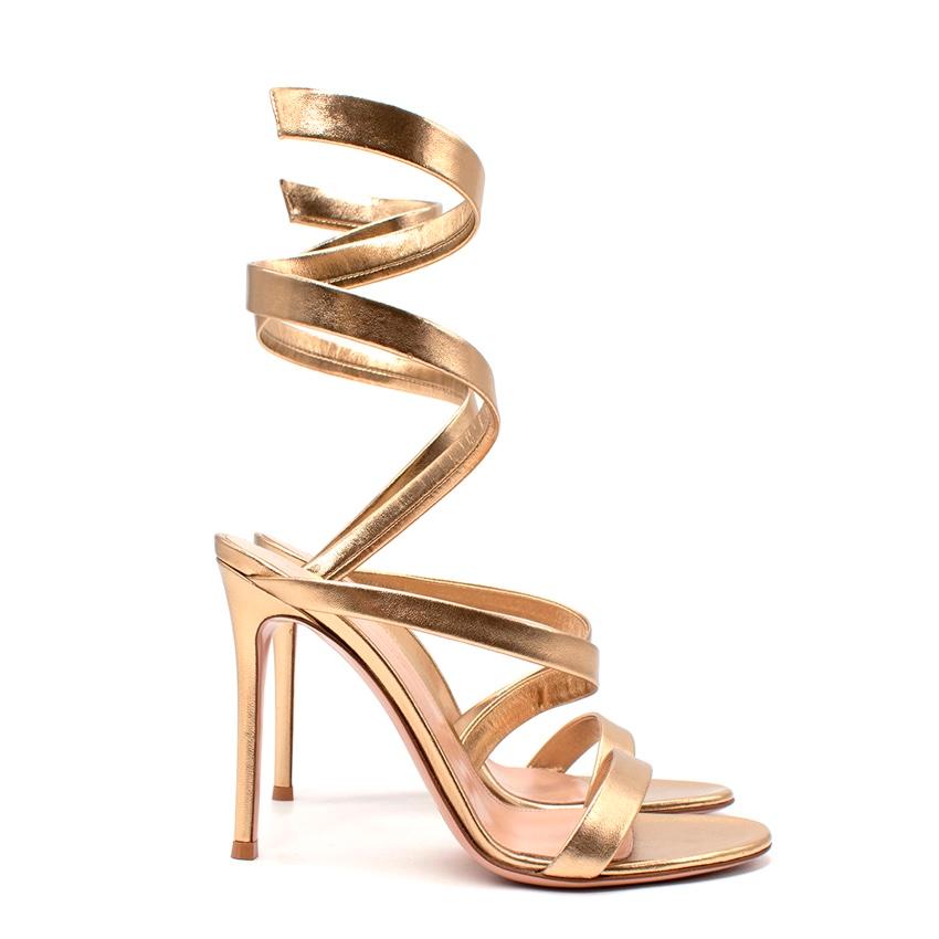 Gianvito Rossi Opera 105 Metallic Leather Sandals
 

 -gold 
 -leather
 -open toe
 -twist detailing
 -branded insole
 -high heel
 

 Made in Italy 
 

 Materials 
 Outer: Leather 100%
 Lining: Leather 100%
 Sole: Leather 100%
 

 PLEASE NOTE, THESE