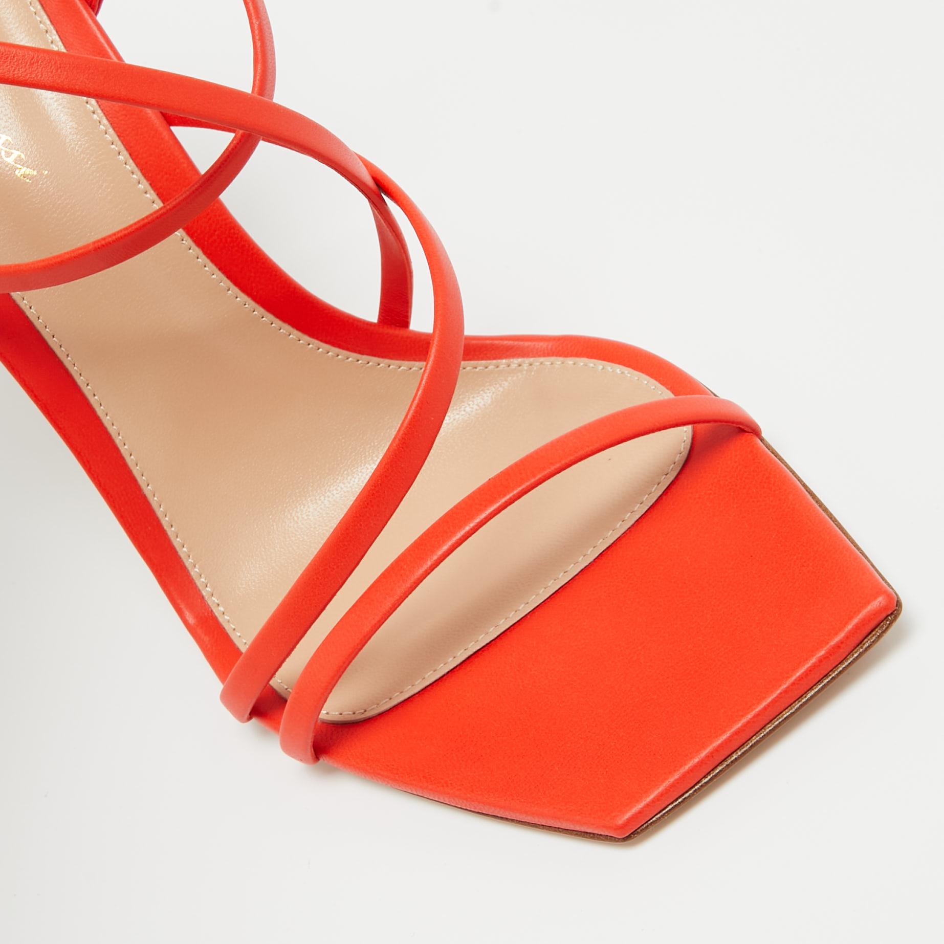 In vibrant orange leather, the Gianvito Rossi Manilla sandals exude confident charm. Delicate straps gracefully embrace the foot, while a sturdy heel provides stability and style. With impeccable craftsmanship and timeless design, these sandals