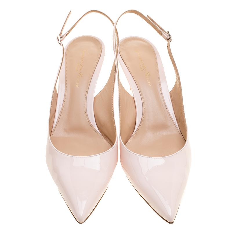 Your elegant feet deserve the best and what better than these sandals from Gianvito Rossi. The regal sandals are crafted from patent leather in pale pink and designed with slingbacks, pointed toes, and 6.5 cm heels. Flaunt the pair with your dresses