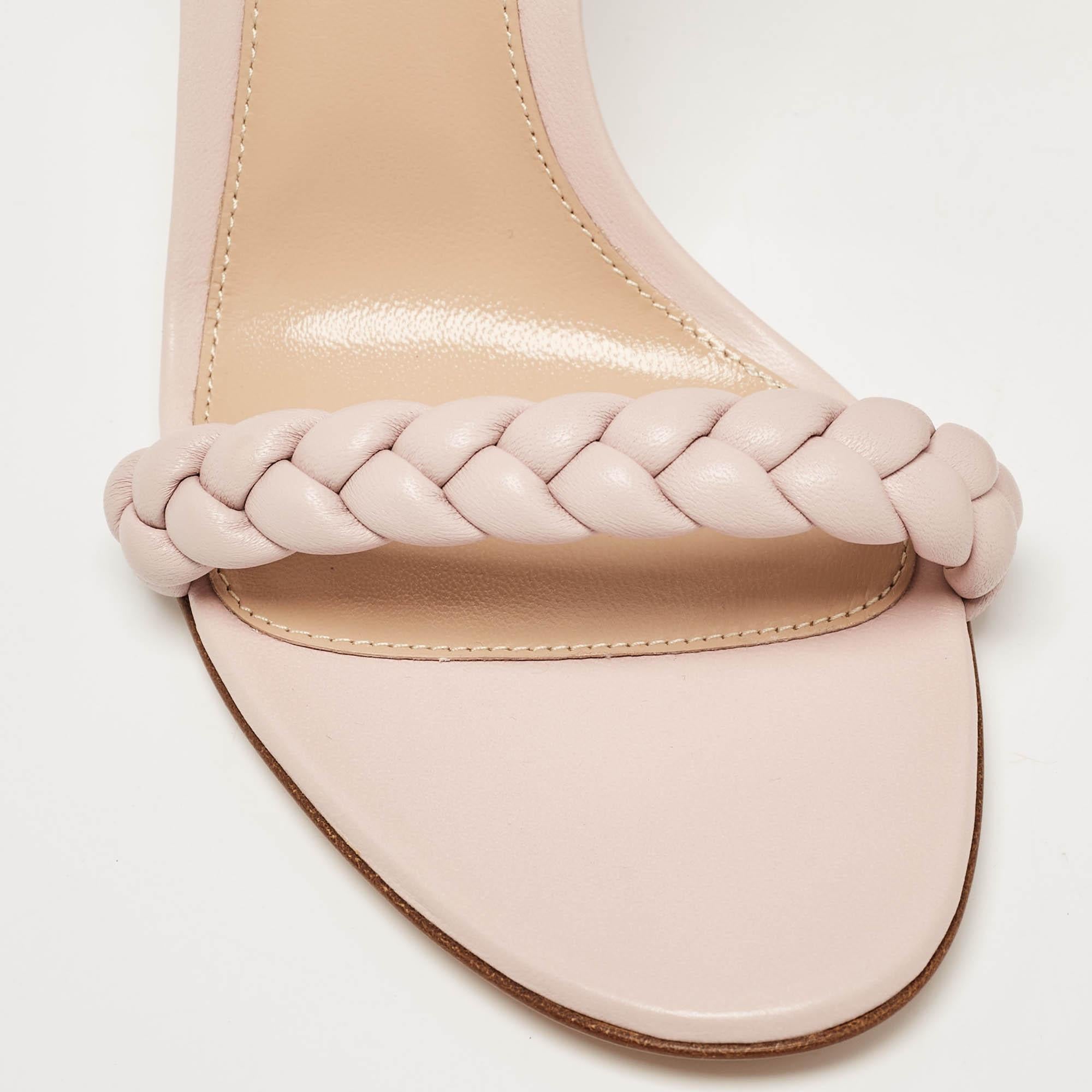 Experience effortless charm with Gianvito Rossi's Leomi sandals. Crafted with meticulous attention to detail, these sandals feature supple pink leather intricately woven to create a delicate yet sturdy design. Perfect for adding a touch of