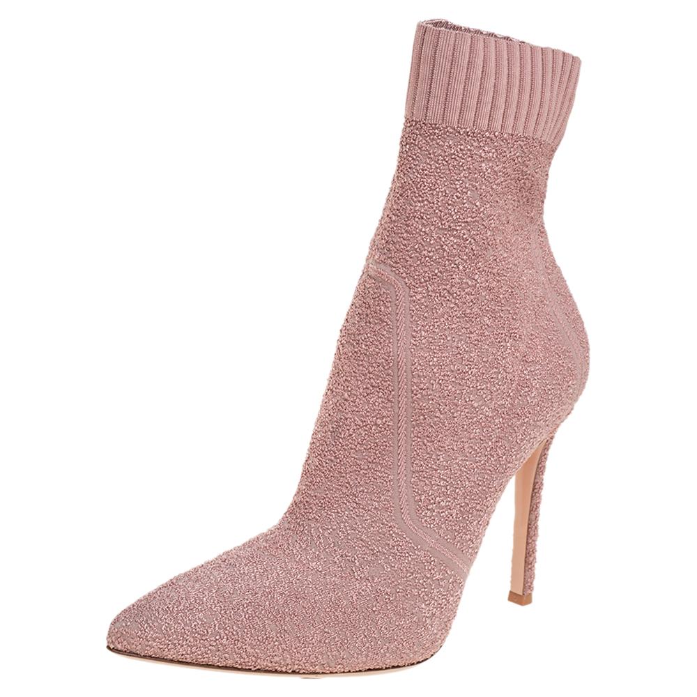 Add the Gianvito Rossi charm to your shoe collection with this pair of ankle boots. Crafted using stretch fabric, the pink boots feature pointed toes and a comfortable, sock-like fit. They are lifted on 11 cm heels.

Includes: Original Dustbag,