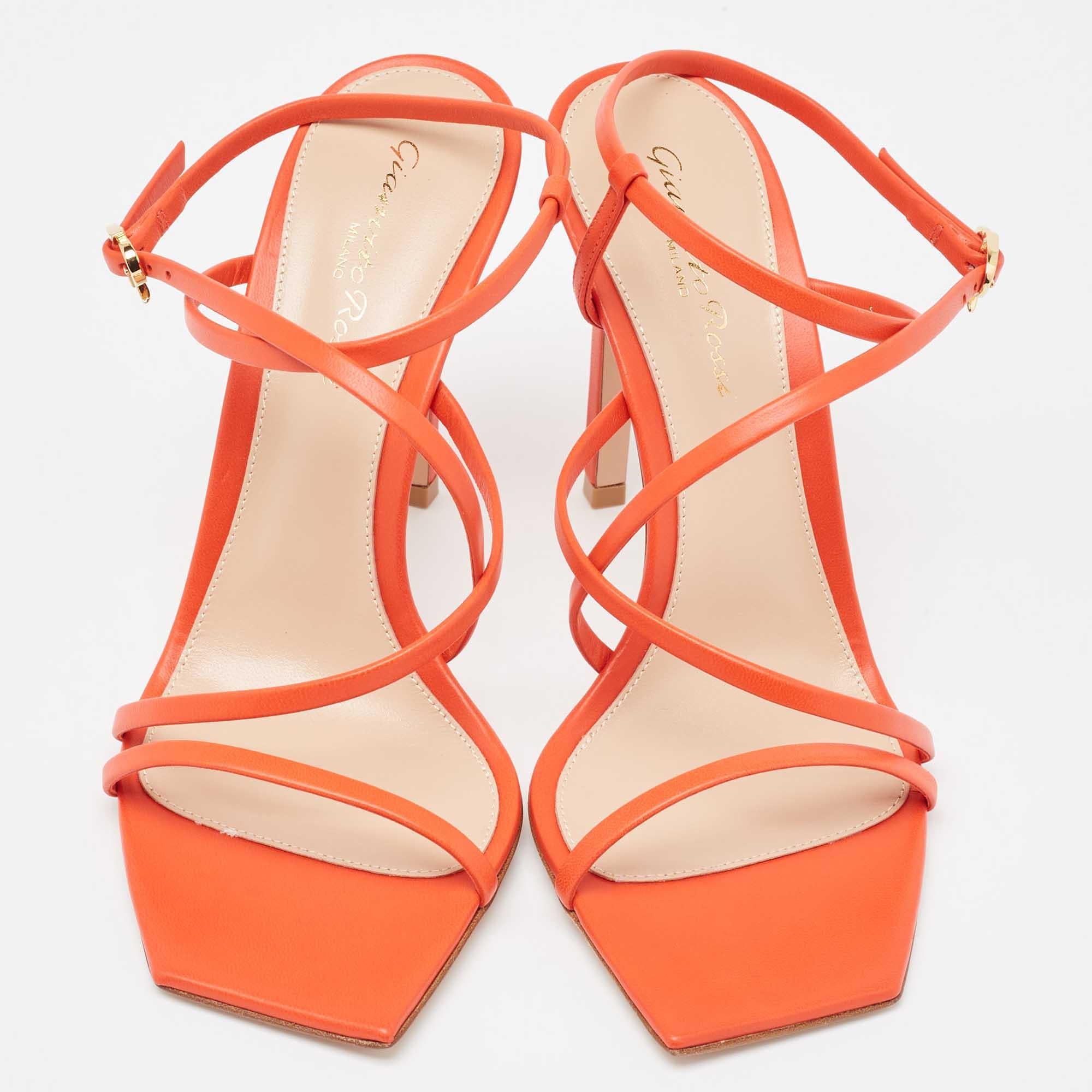 In vibrant poppy red leather, the Gianvito Rossi Manilla sandals exude confident charm. Delicate straps gracefully embrace the foot, while a sturdy heel provides stability and style. With impeccable craftsmanship and timeless design, these sandals