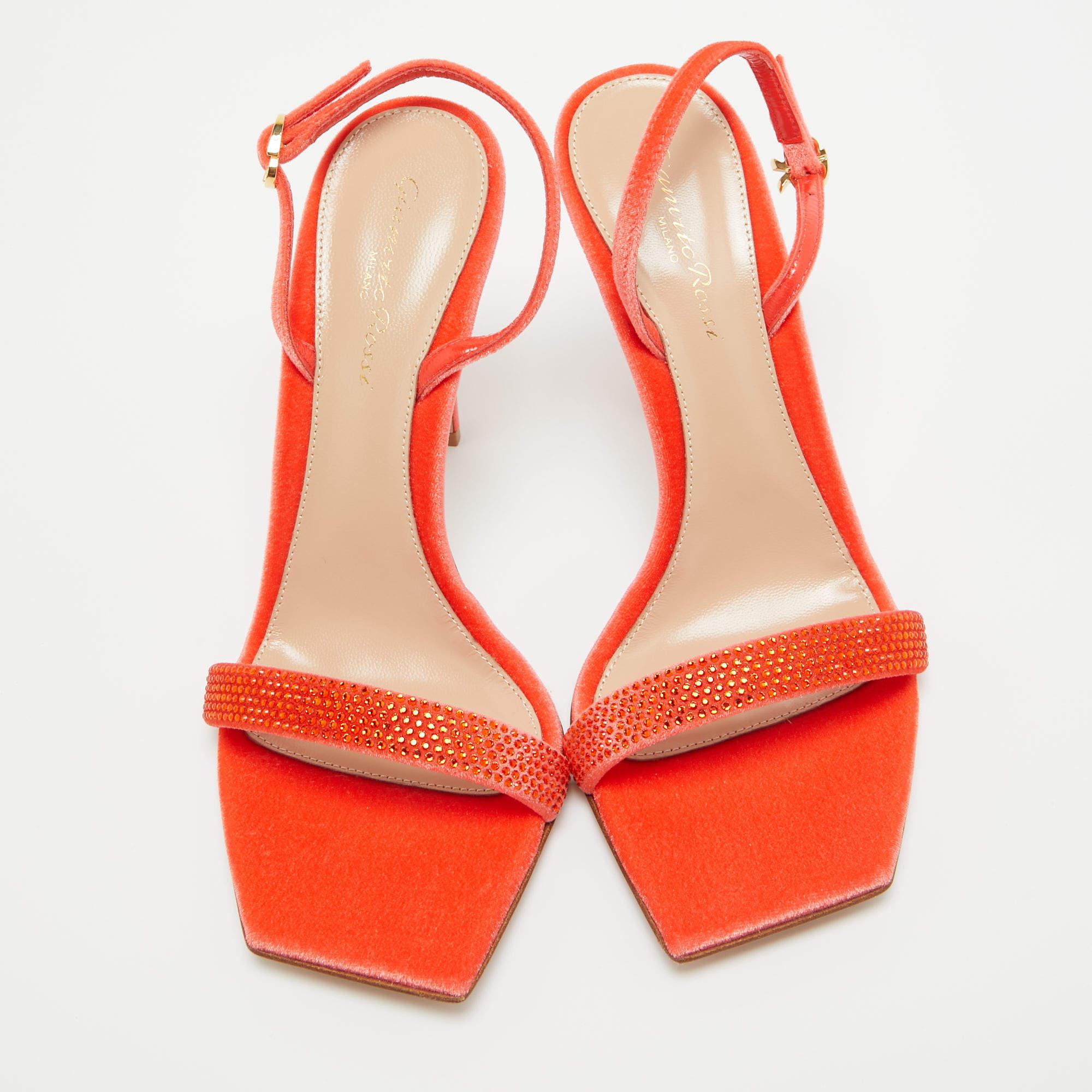 In poppy red leather the Gianvito Rossi sandals exude confident charm. Delicate straps gracefully embrace the foot while a sturdy heel provides stability and style. With impeccable craftsmanship and timeless design these sandals effortlessly command