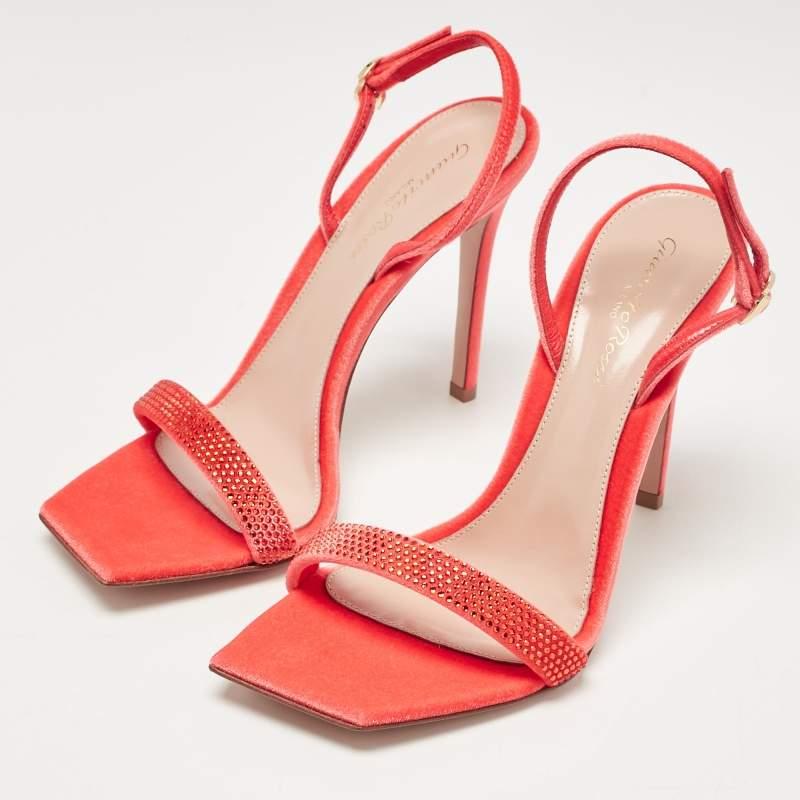In poppy red leather the Gianvito Rossi Britney sandals exude confident charm. Delicate straps gracefully embrace the foot while a sturdy heel provides stability and style. With impeccable craftsmanship and timeless design these sandals effortlessly