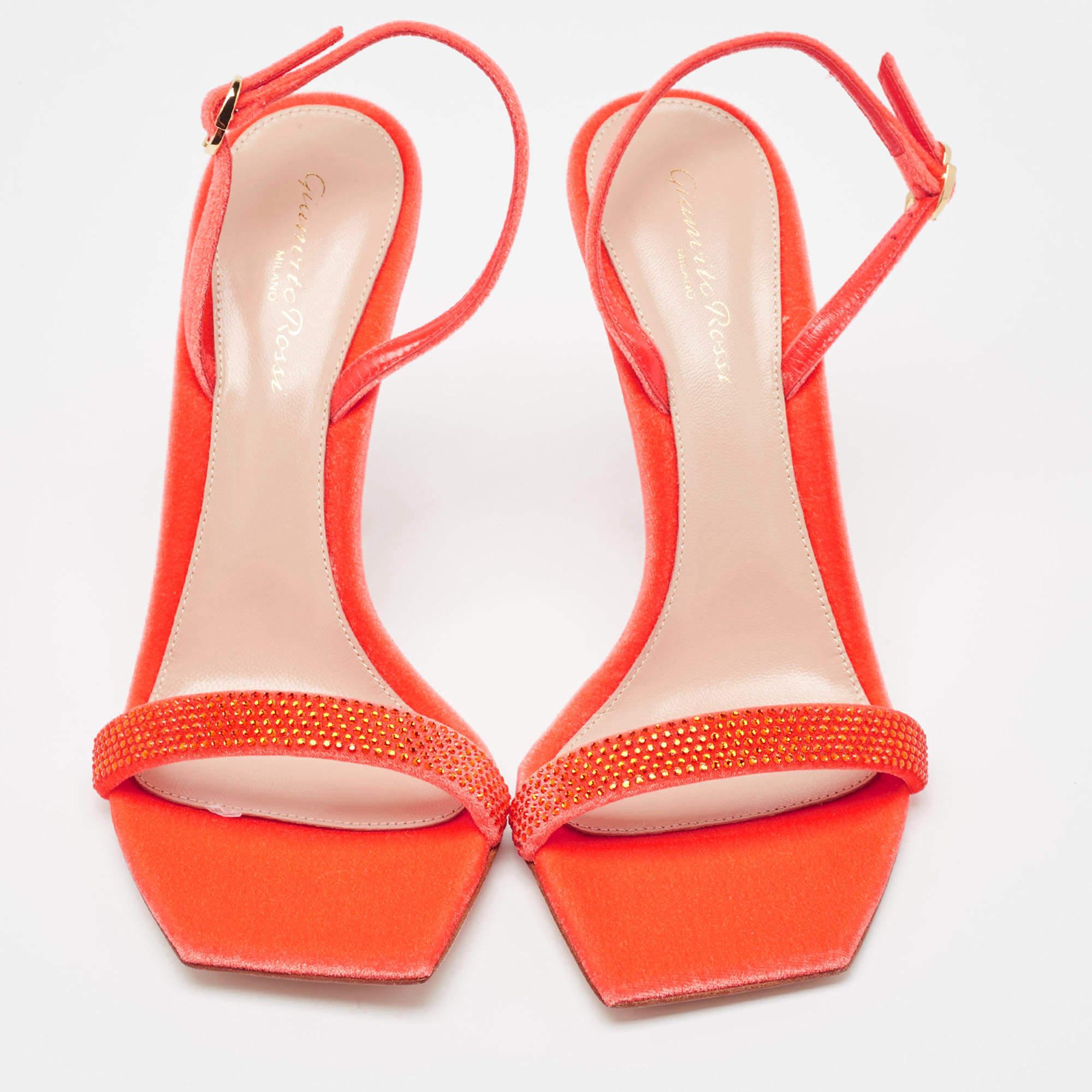 In vibrant red velvet, the Gianvito Rossi sandals exude confident charm. Delicate straps gracefully embrace the foot, while a sturdy heel provides stability and style. With impeccable craftsmanship and timeless design, these sandals effortlessly