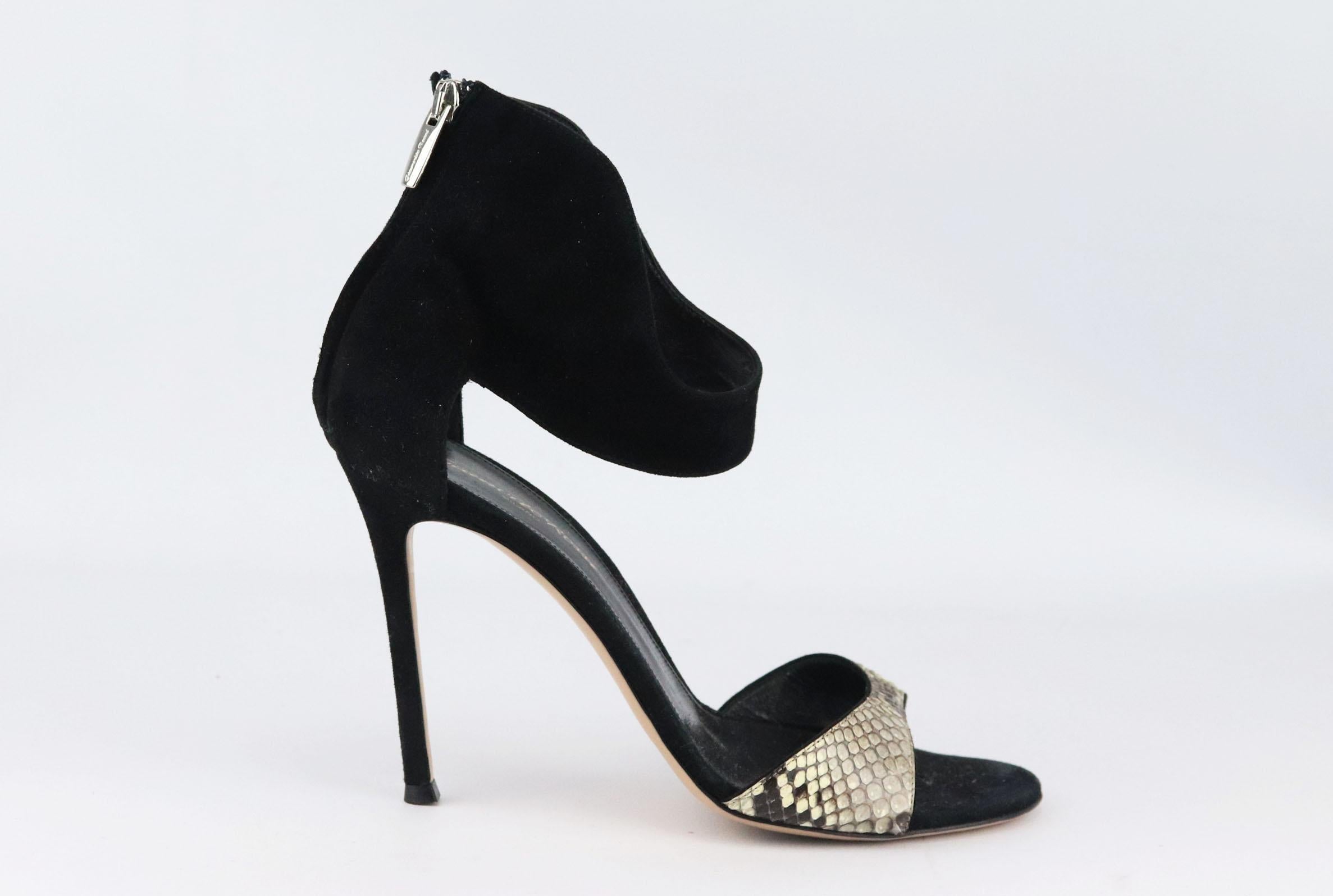 Gianvito Rossi's sandals have been hand-finished in Italy from sumptuous black suede and grey python, this versatile pair has two straps that elegantly frame your ankle and toes.
Heel measures approximately 89 mm/ 3.5 inch.
Black suede, grey