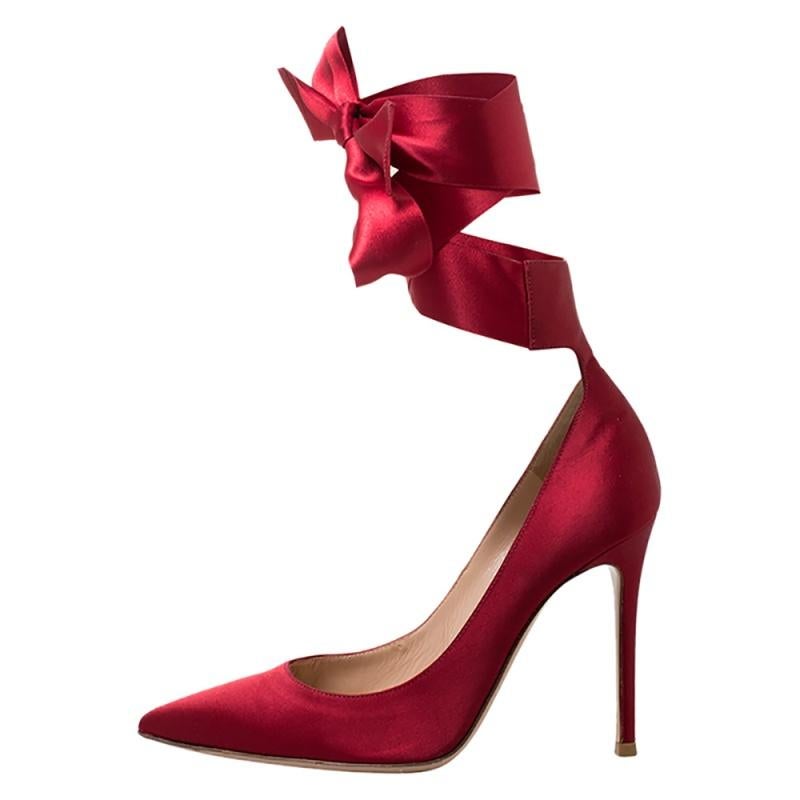 Revamp your style quotient by adding this pair of Gianvito Rossi pumps to your collection. Crafted in Italy from quality satin, they come in a striking hue of red. They are styled with pointed toes, ankle wraps that add a hint of glamour and 10.5 cm