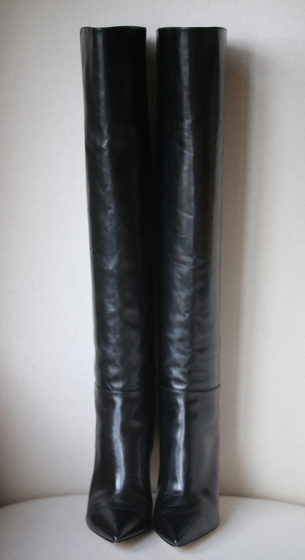 These leather, pointed toe, over-the-knee boots are the definition of show stopper. Simple and immensely flattering to the figure, these boots are the season's all around must-have. Made in Italy, these boots include an inner leg zip and black