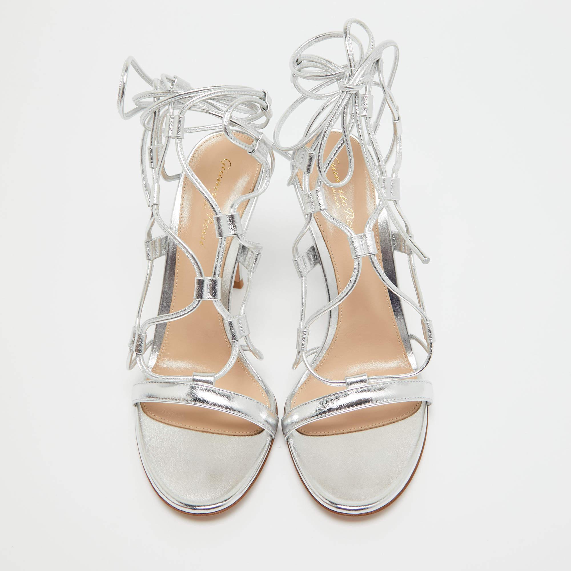 In classy silver leather, the Gianvito Rossi Giza sandals exude confident charm. Delicate straps gracefully embrace the foot, while a sturdy heel provides stability and style. With impeccable craftsmanship and timeless design, these sandals