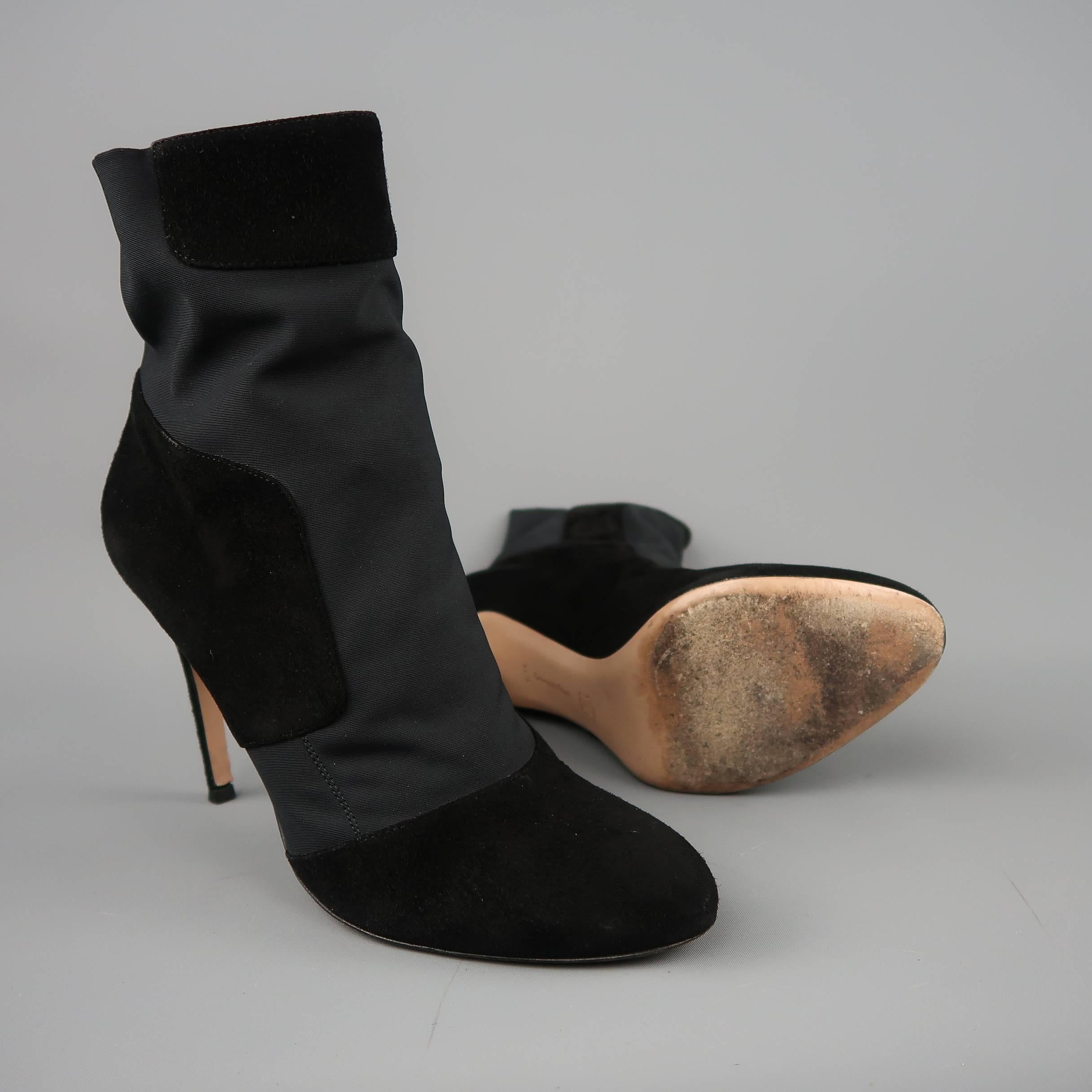 GIANVITO ROSSI ankle booties come in black suede with stretch panels, a rounded point toe, and covered stiletto heel. Made in Italy.
 
Good Pre-Owned Condition.
Marked: IT 40.5
 
Measurements:
 
Heel: 4.25 in