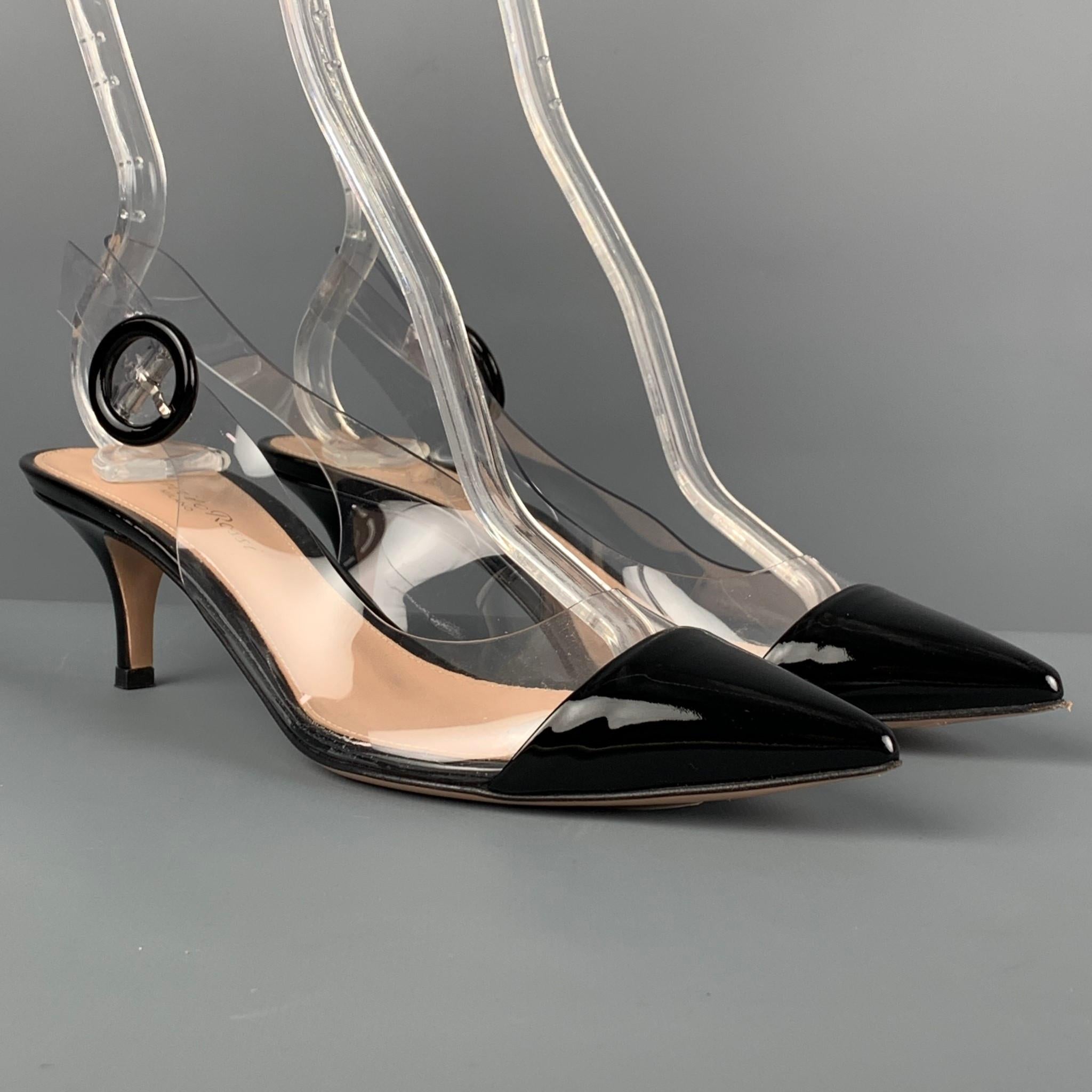 GIANVITO ROSSI pumps comes in a clear acetate with a black patent leather trim featuring a pointed toe, strap closure, and a kitten heel. Comes with box.

Very Good Pre-Owned Condition.
Marked: 36.5
Original Retail Price: