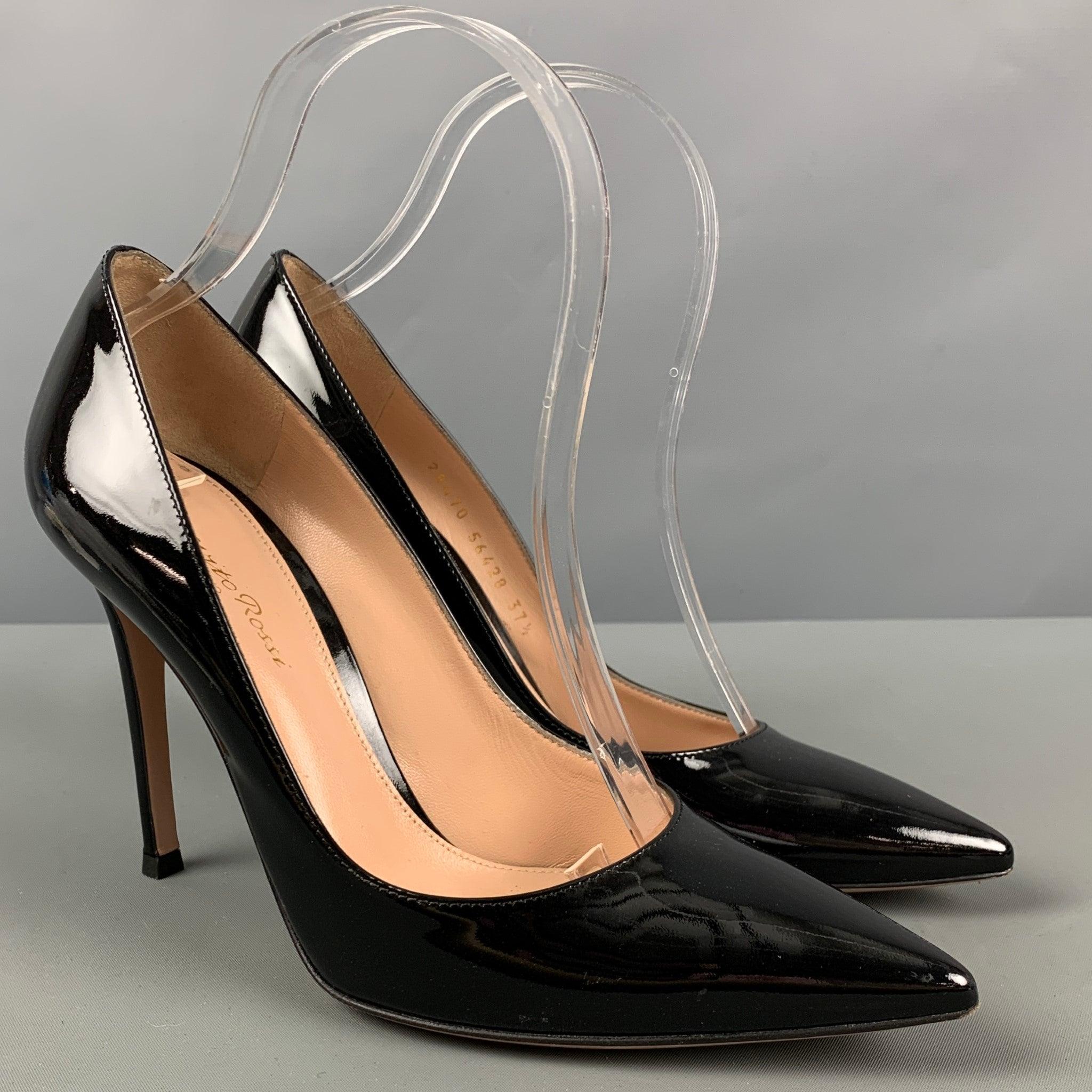 GIANVITO ROSSI pumps in a black patent leather featuring a pointed toe. Made in Italy.Excellent Pre-Owned Condition. 

Marked:   28470 56428 

Measurements: 
  Length: 8.25 inches 
Width: 3 inches Height: 6.25 inches 
  
  
 
Reference: