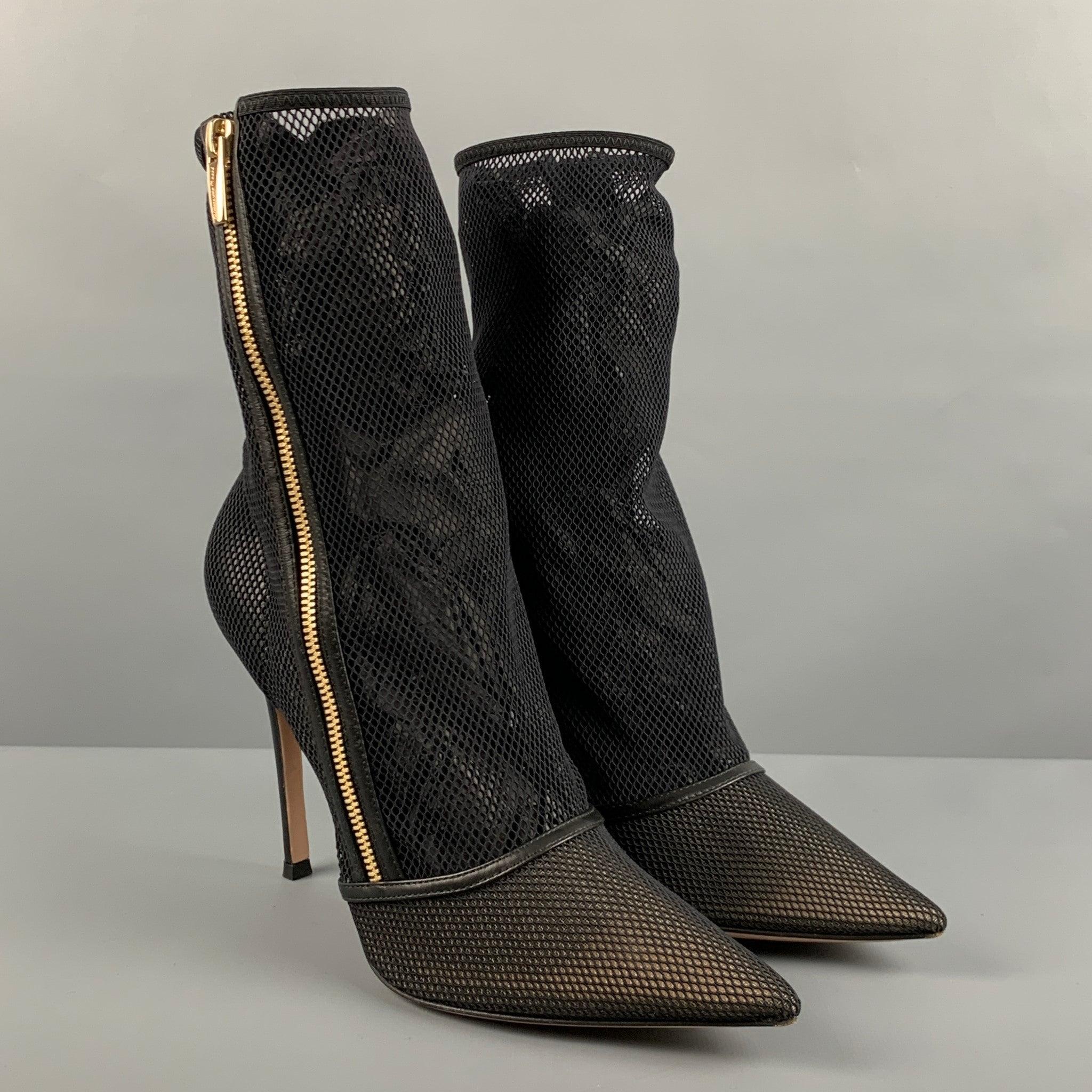 GIANVITO ROSSI ankle boots comes in a black mesh material featuring a pointed toe, side zipper closure, and a stiletto heel. Comes with box. Made in Italy.Very Good Pre-Owned Condition. Minor signs of wear. 

Marked:   39.5 

Measurements: 
  Heel:
