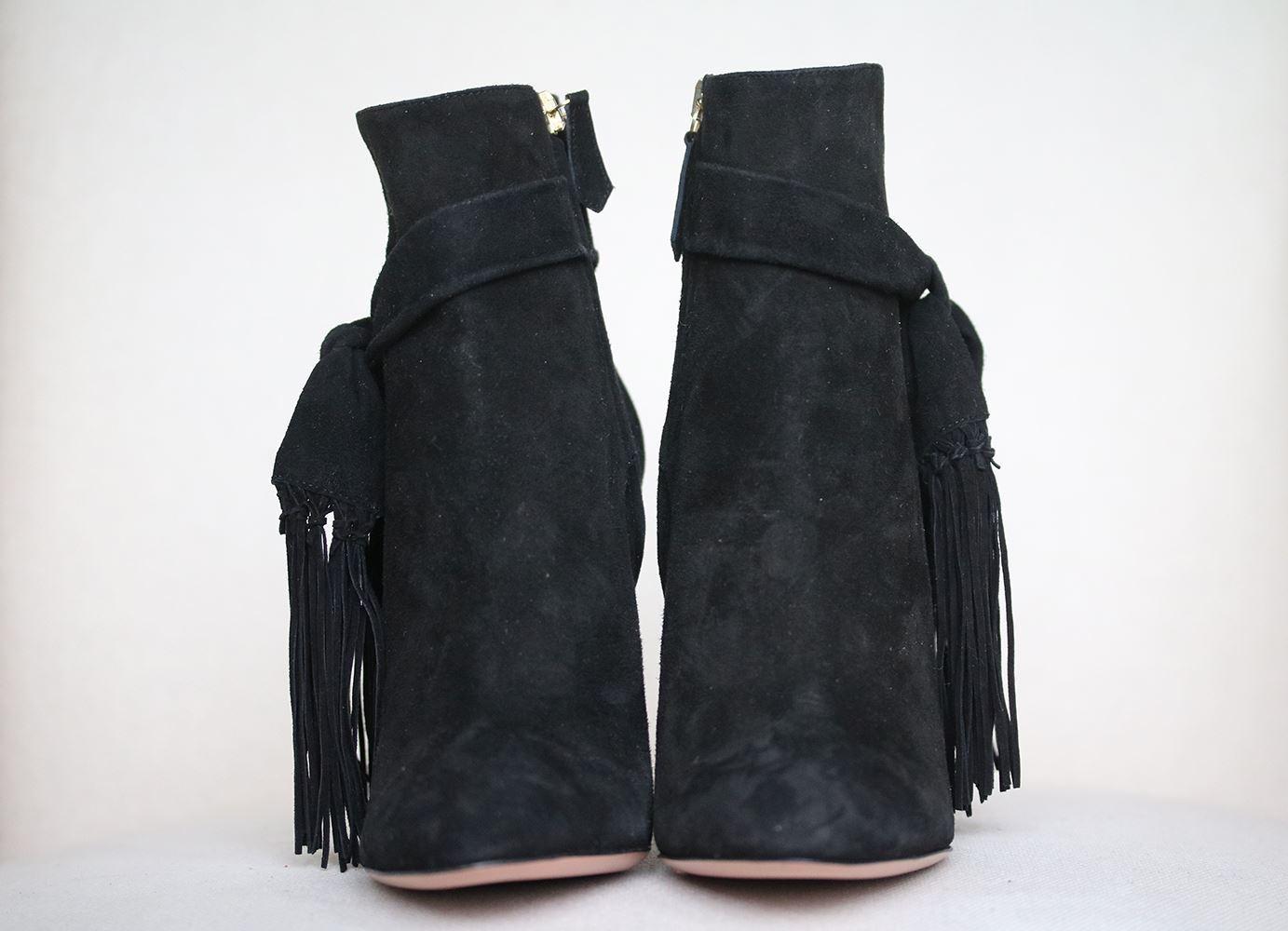 Suede bootie with wrap around tassel straps. Suede upper. Heel measures approximately 105 mm/ 4 inches. Black suede. Made in Italy. Does not come with a box. 

Size: EU 37.5 (UK 4.5, US 7.5)

Condition: New without box. 