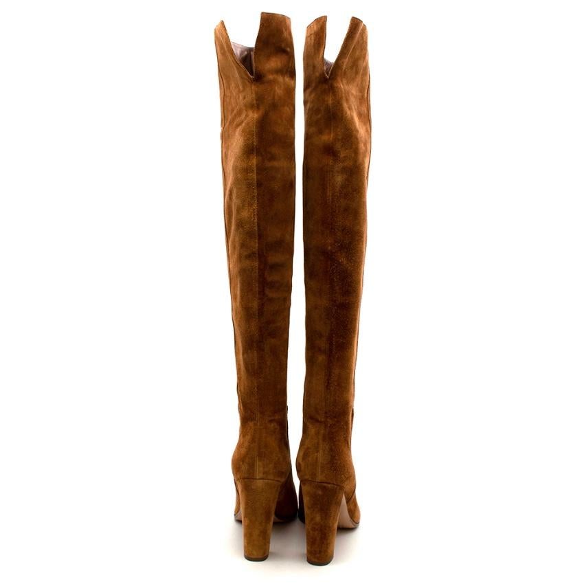 Gianvito Rossi Tan Suede over-the-knee boots

- brown
- suede/leather
- square toe
- slip-on style
- knee-high
- high block heel

Lining: Leather 100%
Sole: Leather 100%, Rubber 100%
Outer: Suede 100%

Height - 62cm
Heel - 10.5cm
Sole - 22cm


