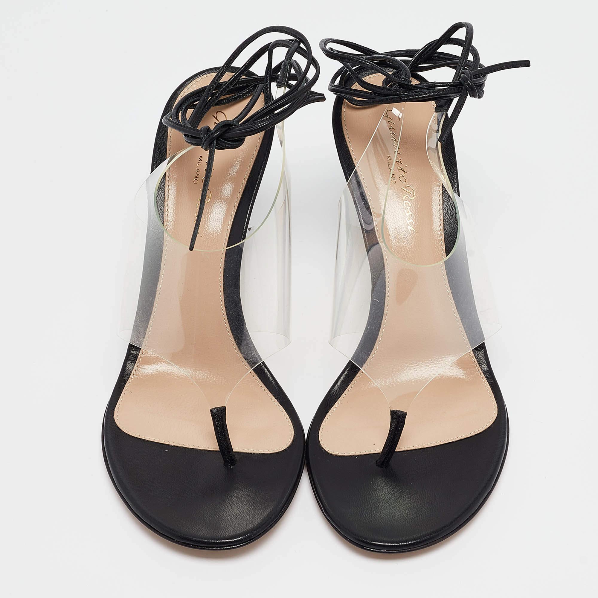 These stylish sandals come from the house of Gianvito Rossi. Crafted in Italy, they are made from leather & PVC that creates a lovely illusion. They are styled with a thong style, leather insoles, soles, and 8.5 cm heels. These are a great option